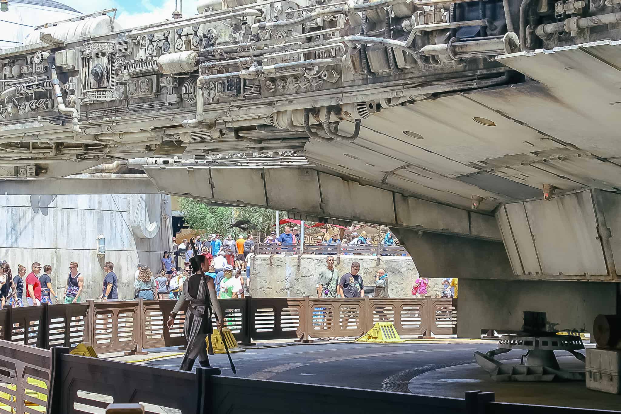 Rey from Star Wars working on the Millennium Falcon at Hollywood Studios. 