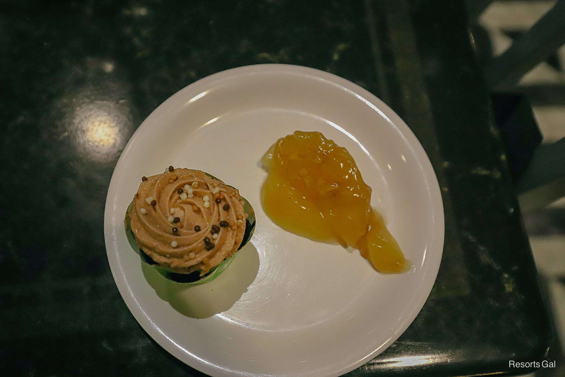 a dessert plate with a cupcake and apple pie 