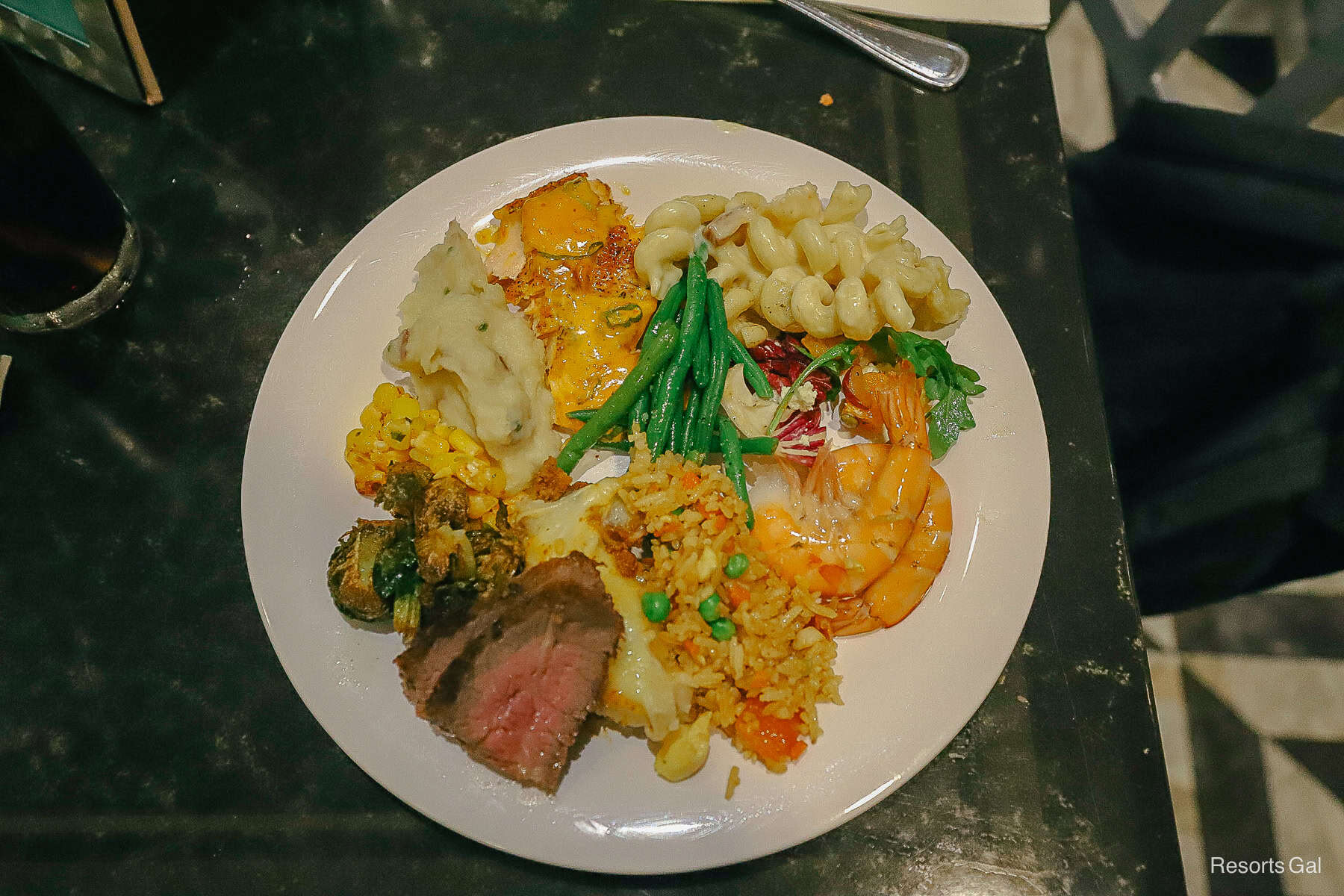 a plate with items prepared from the hot portion of the buffet at Minnie's Halloween Dine 