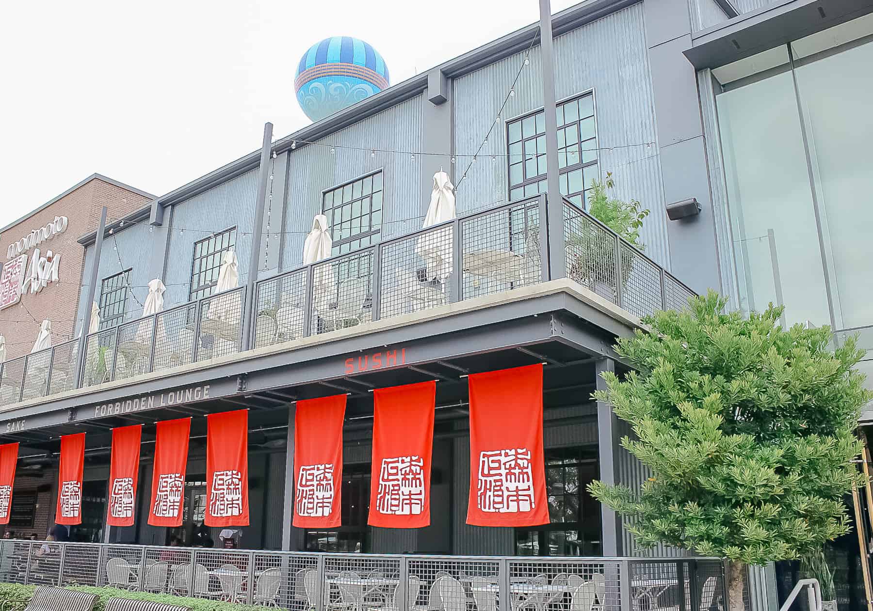 Upper outdoor dining balcony and covered lower level patio at Morimoto Asia 