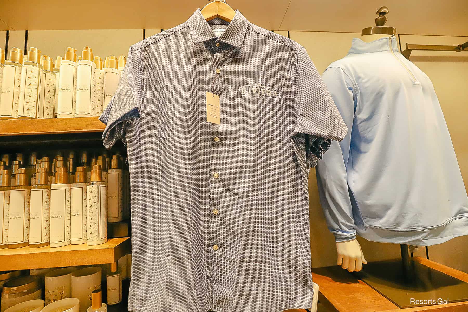 a button up Peter Millar shirt with the Riviera Resort logo