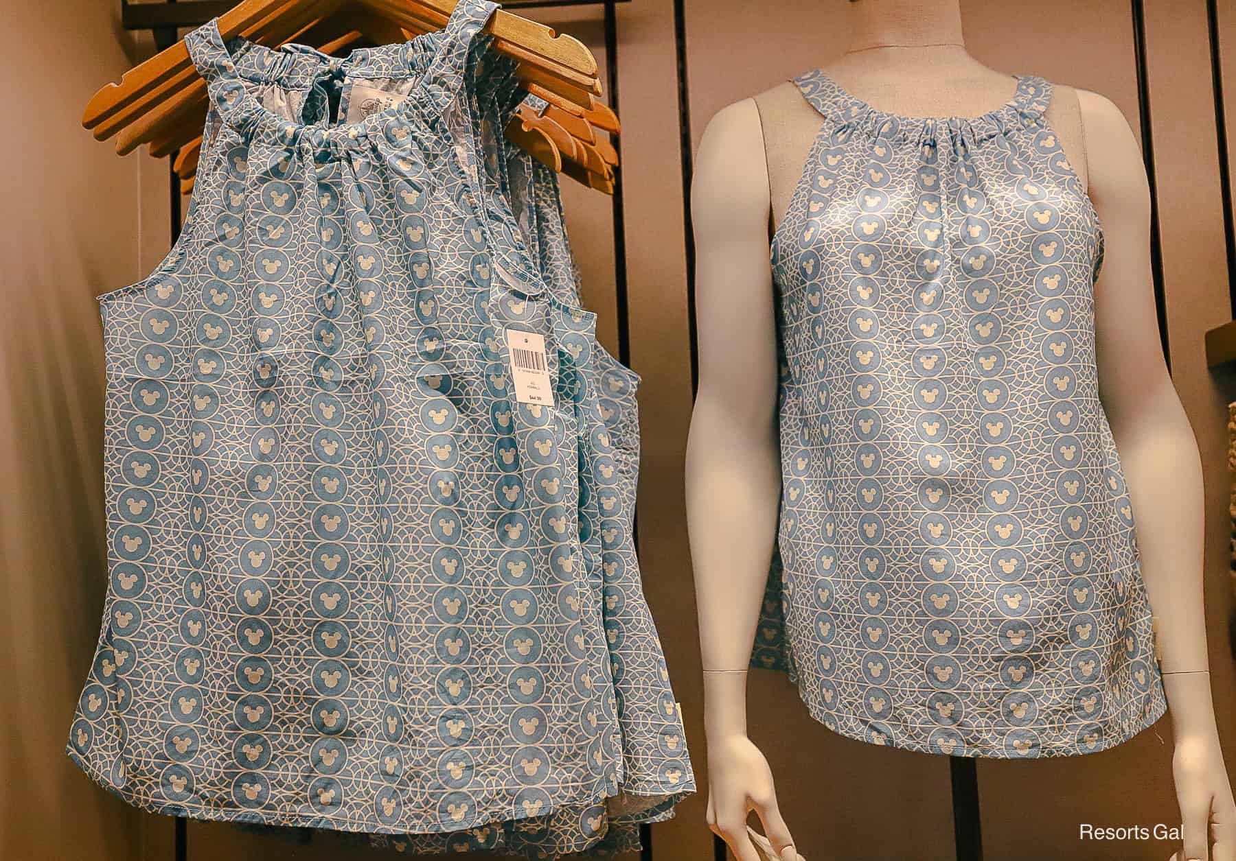a sleeveless blouse with blue Mickey print