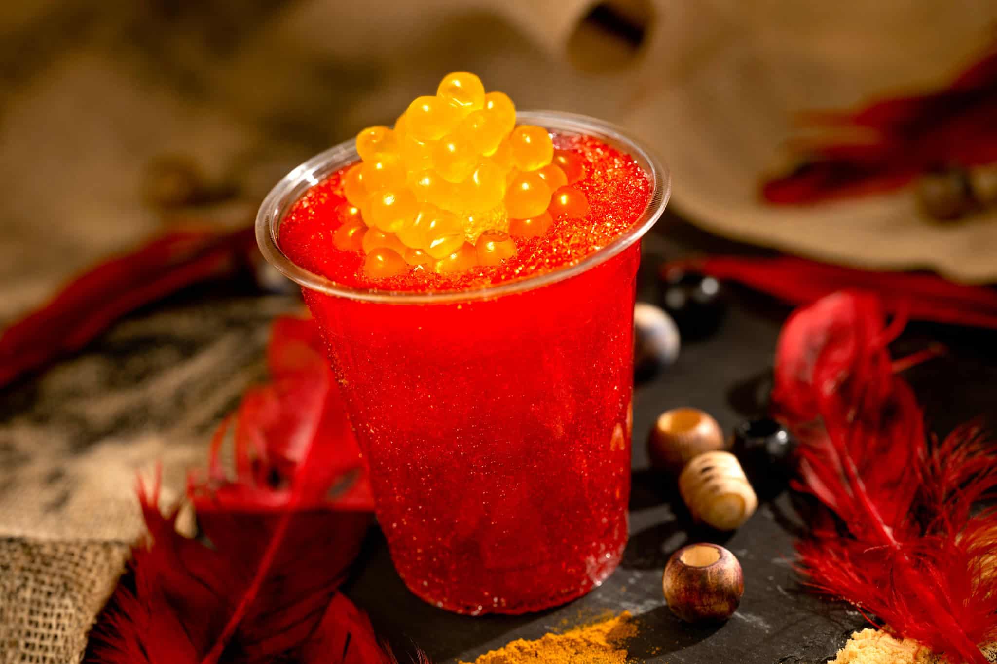 Nightwraith Blaze a red and orange drink topped with boba balls