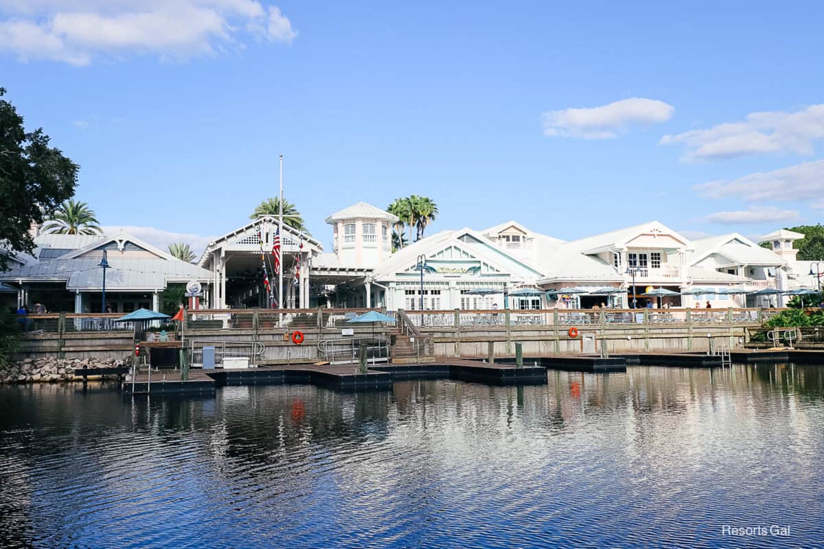 the boat dock at Disney's Old Key West with Hospitality ouse in the backdrop