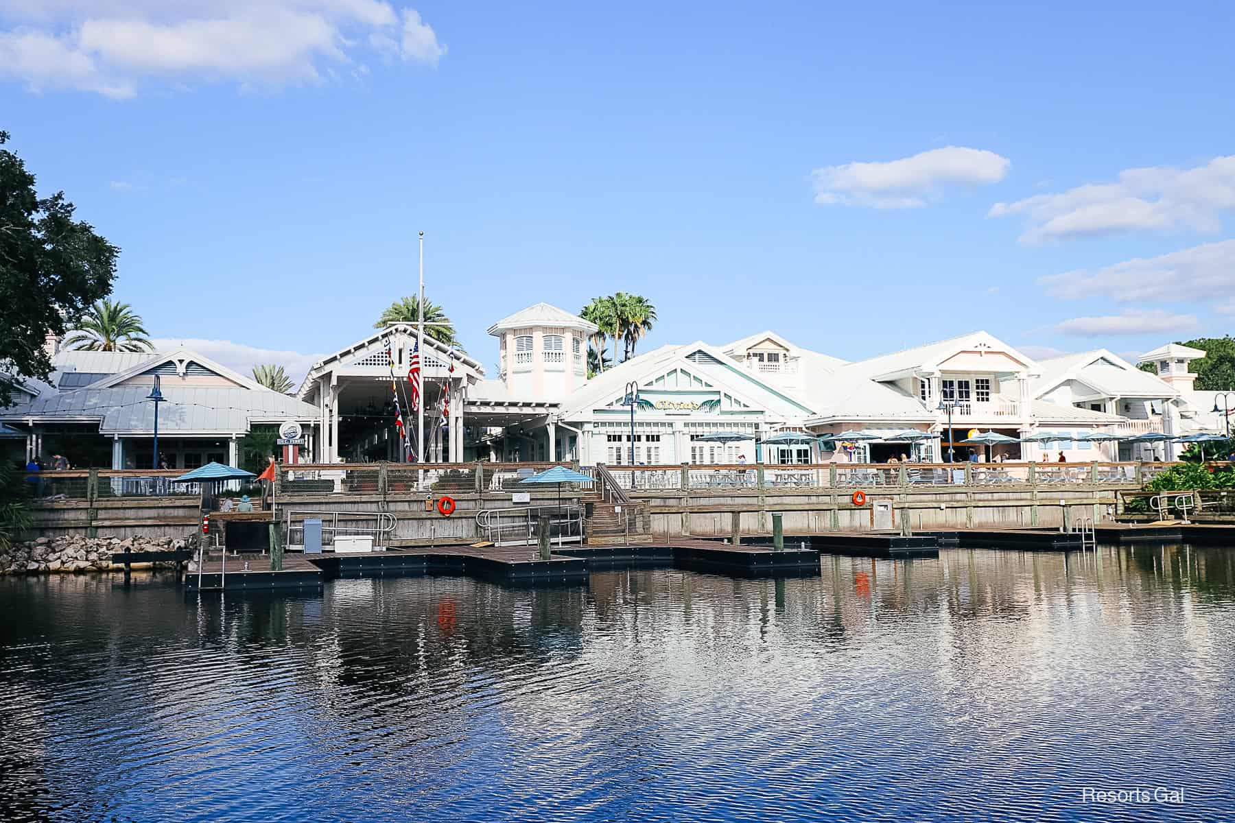 the boat dock at Disney's Old Key West with Hospitality ouse in the backdrop