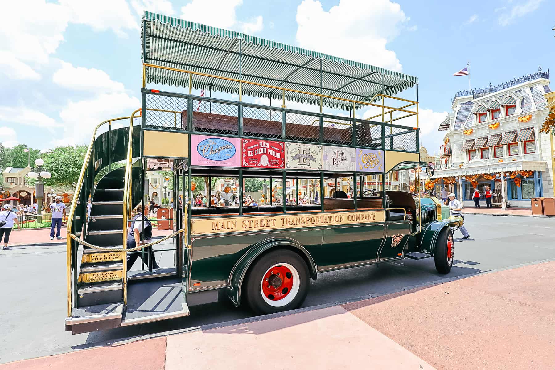Omnibus at Magic Kingdom with a sign that says Main Street Transportation Company. 