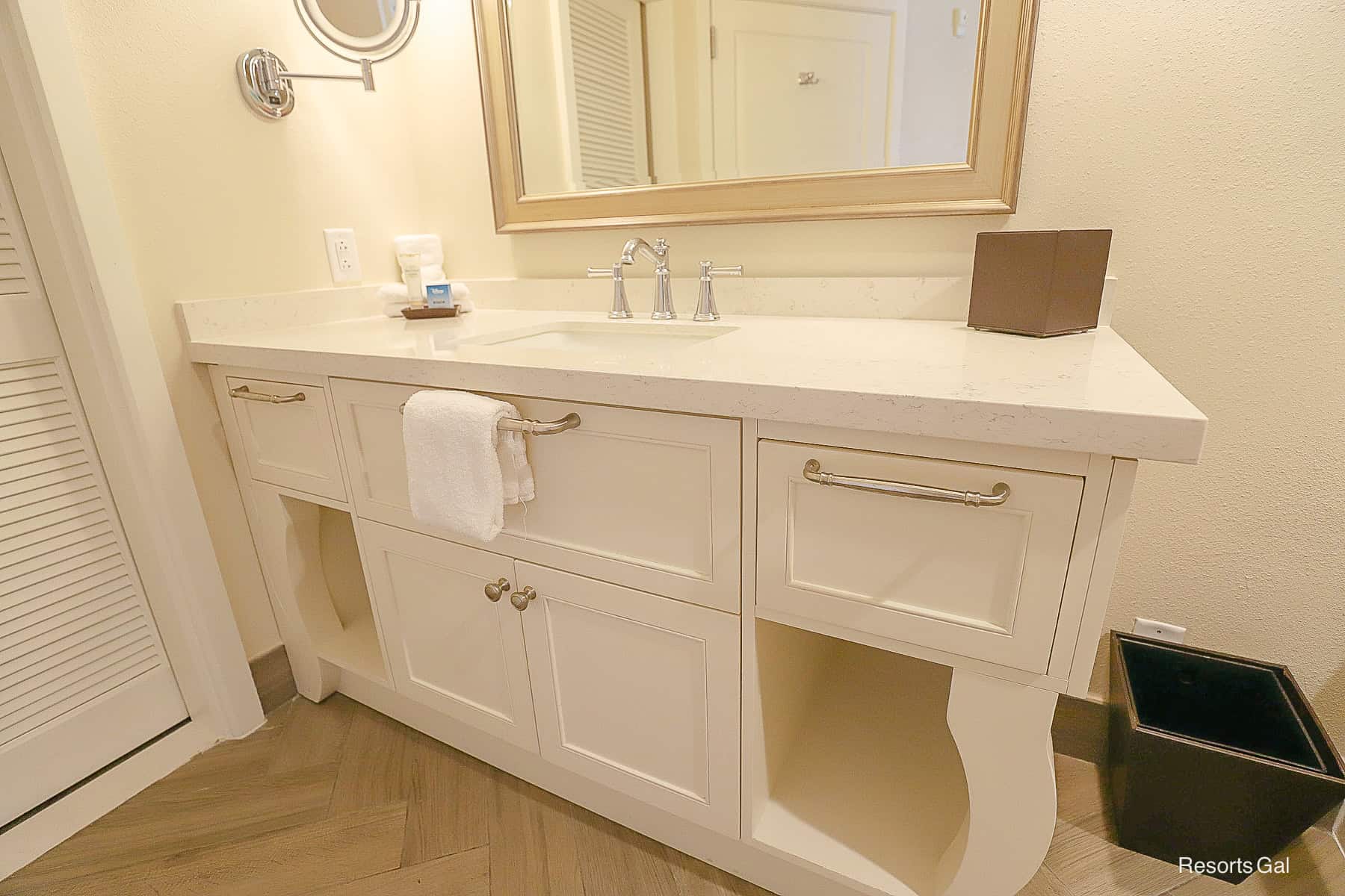 the vanity with extra countertop and storage underneath 