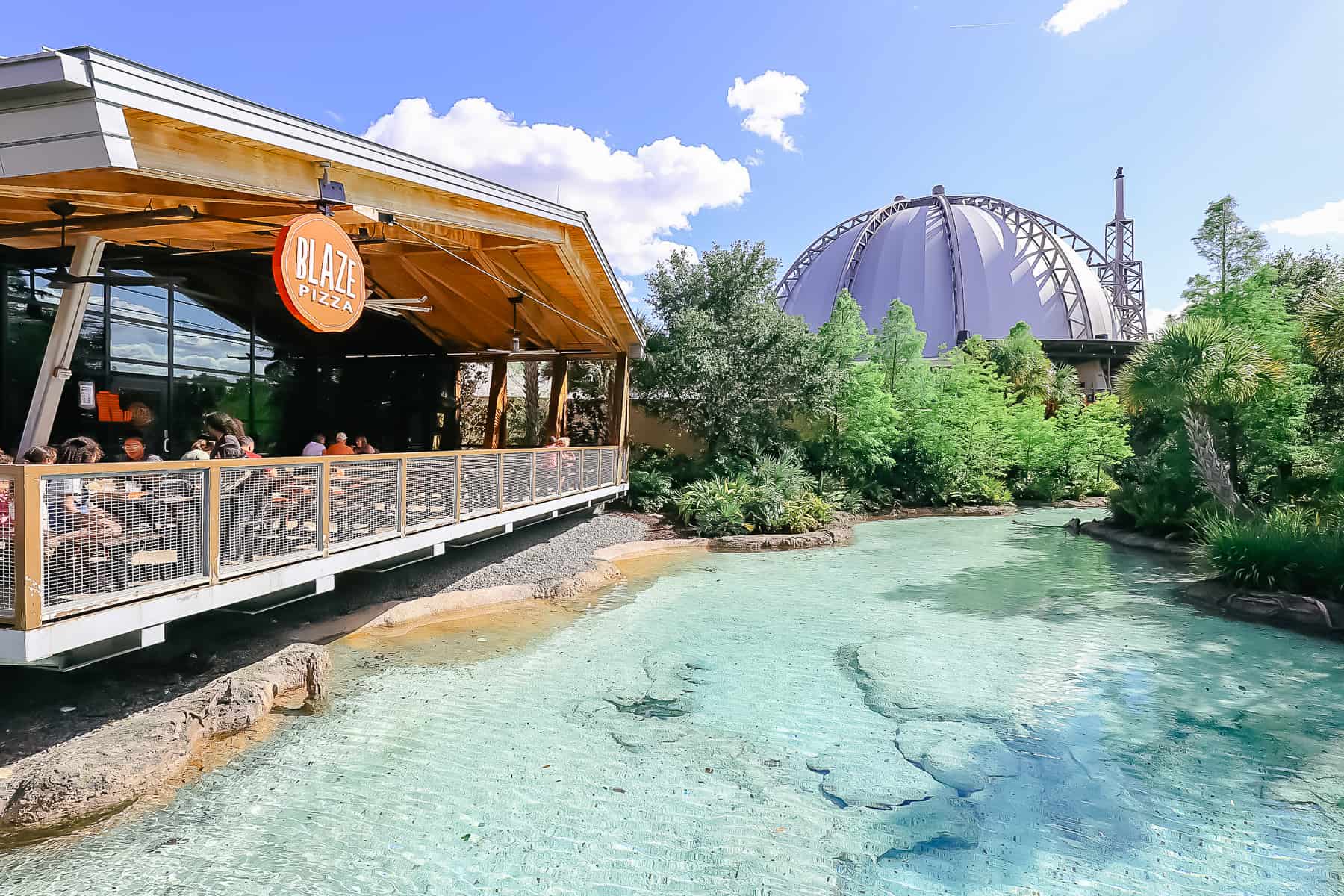Blaze Pizza's outdoor dining area near the springs at Disney Springs. 