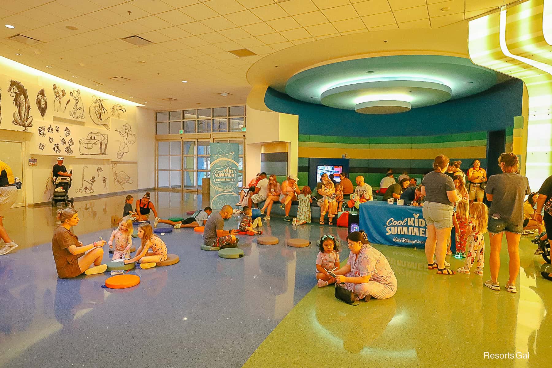 guests enjoying books and activities at the PJ party at Art of Animation