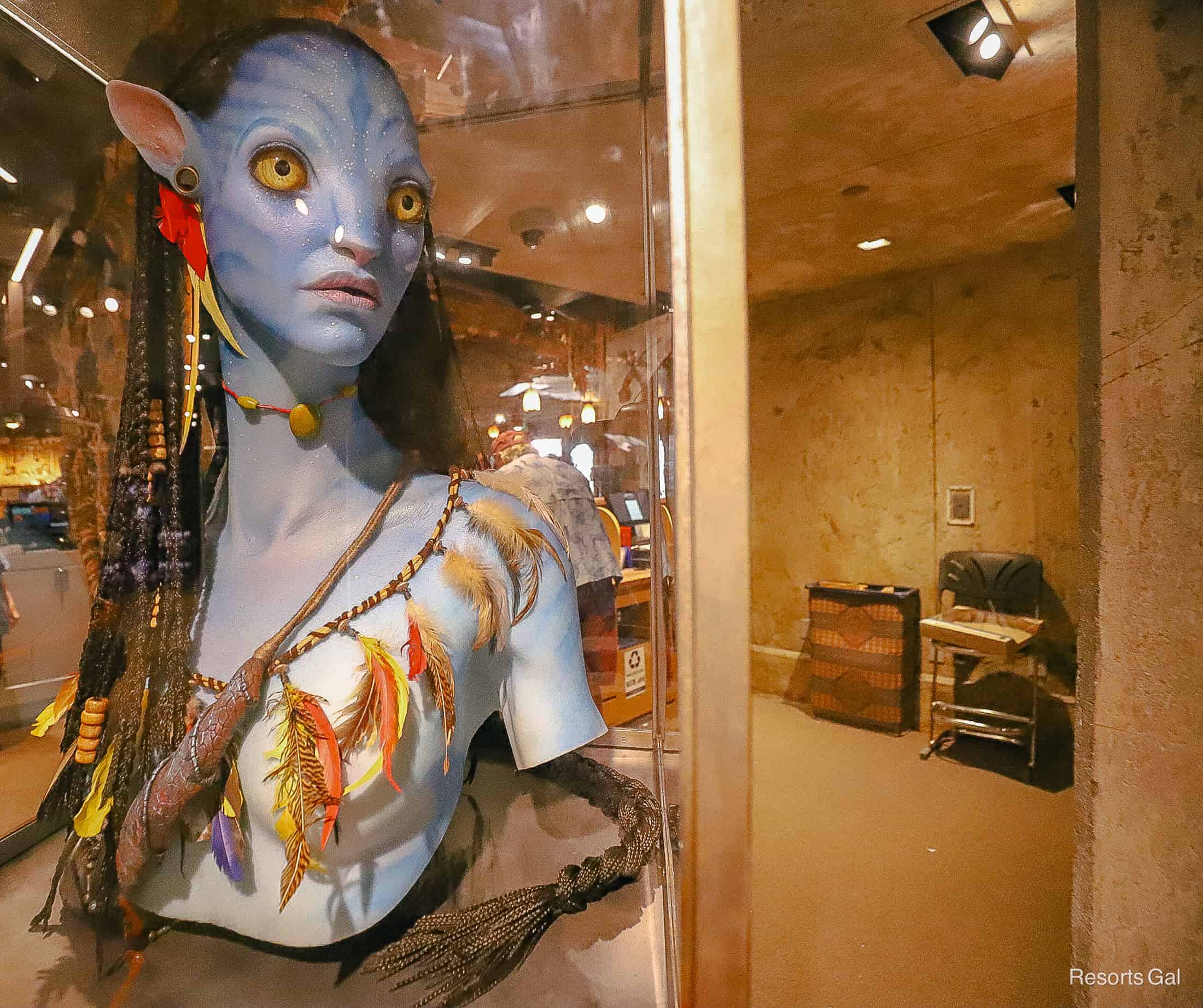 a Na'vi on display at the ride exit of flight of Passage 