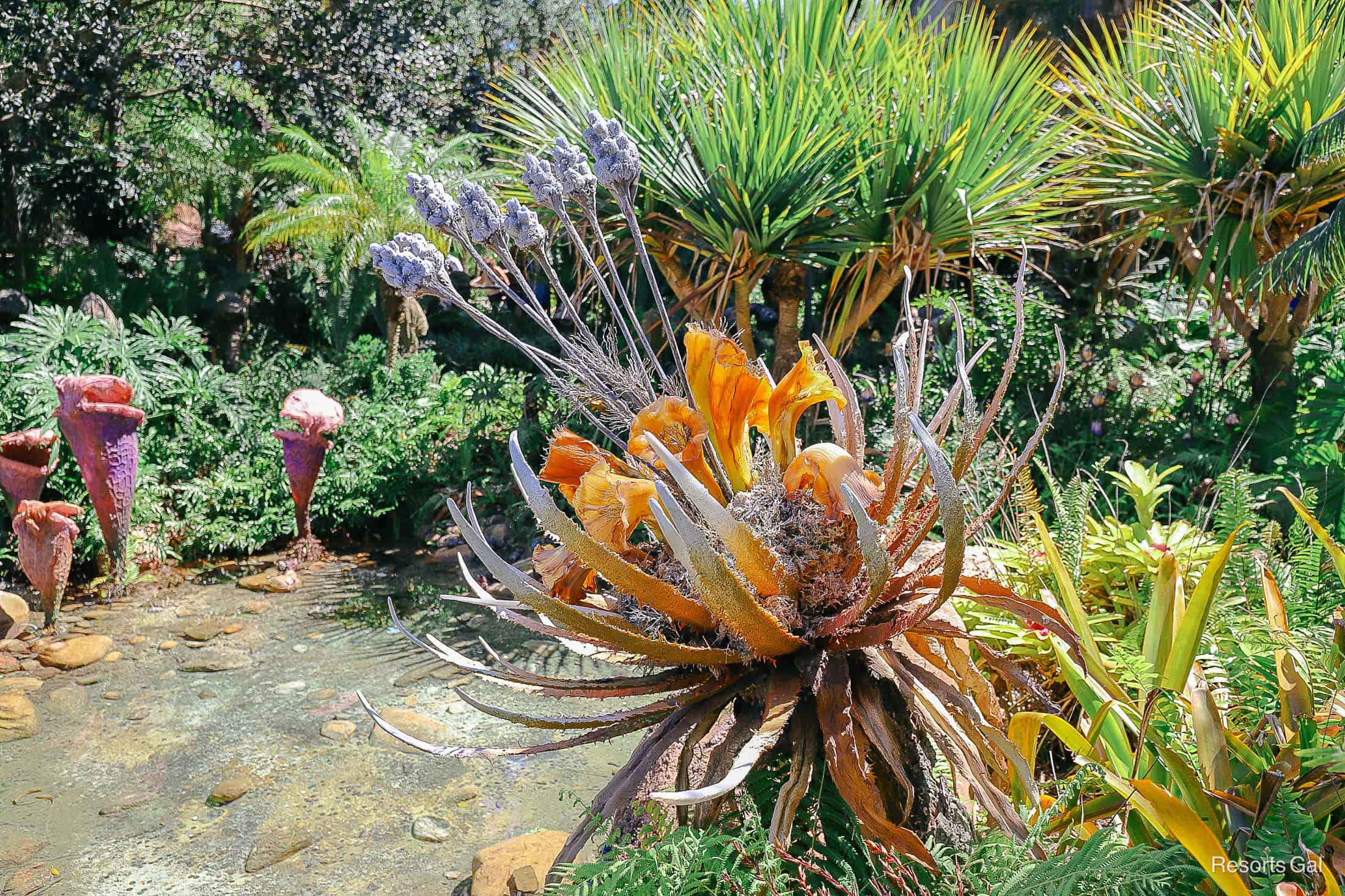 a scenic photo with orange and lavender alien plant life 