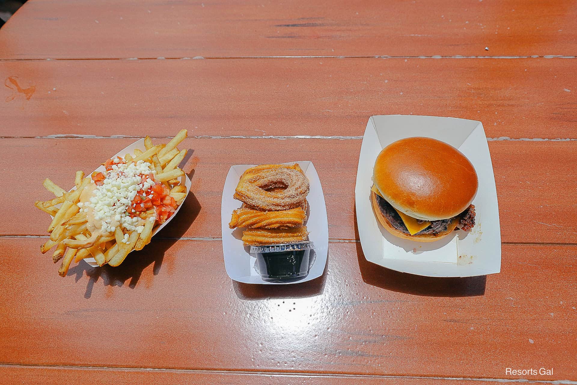 an order of queso fries, churro loops, and a cheeseburger from Pecos Bill at Magic Kingdom