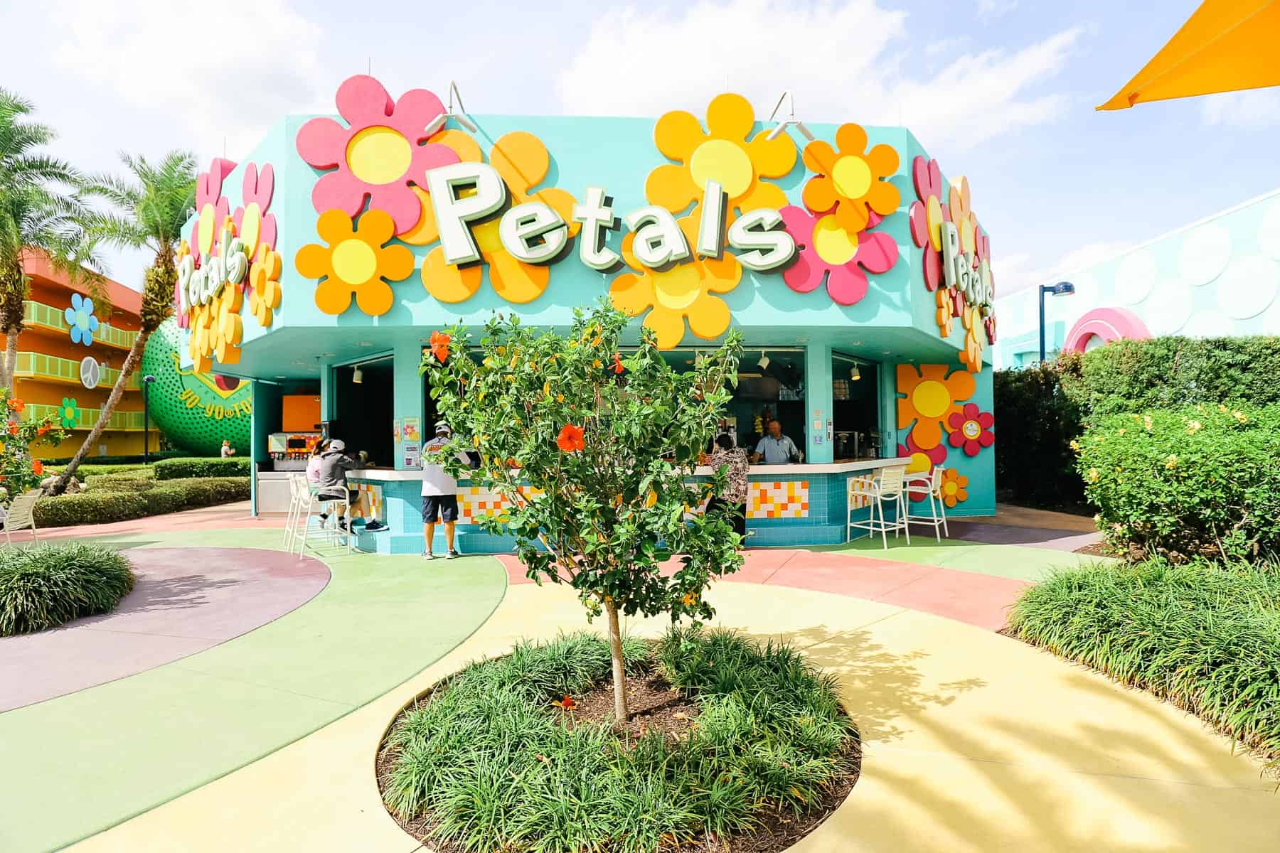 guests at the Petals Pool Bar at Pop Century 