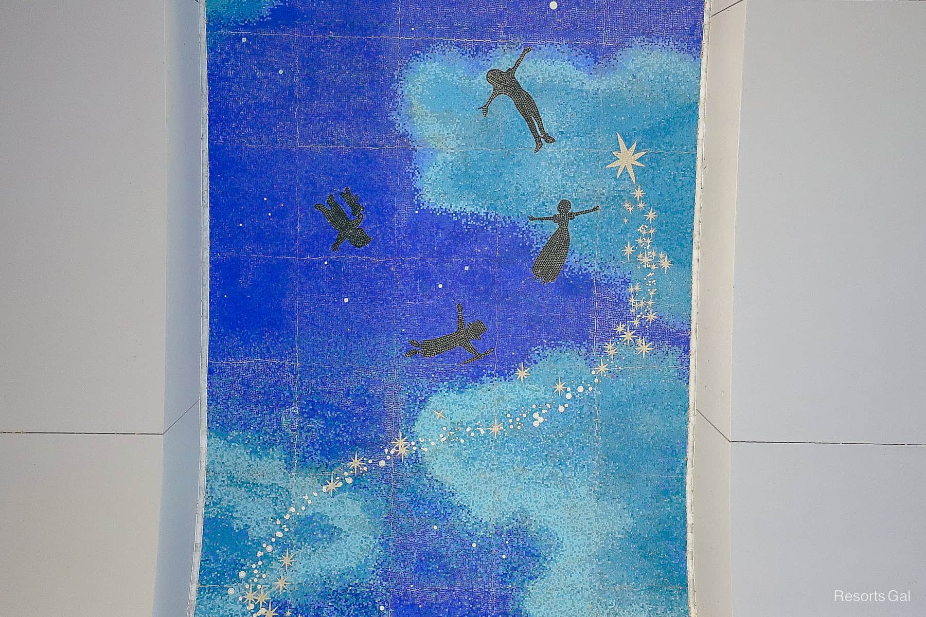 the path of stardust in the mosaic mural surrounds Peter Pan Wendy John and Michael 