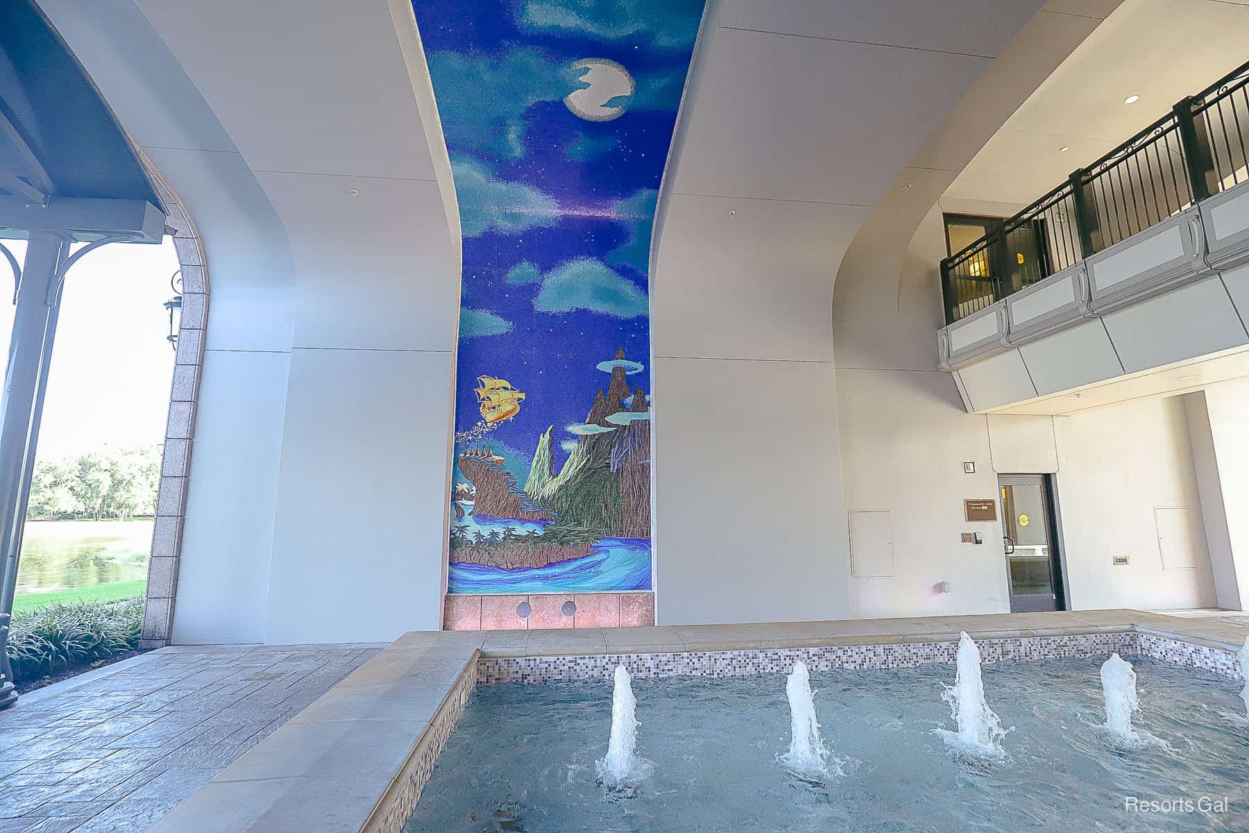 a golden ship takes flight from Neverland in the tile mosaic representing Peter Pan 