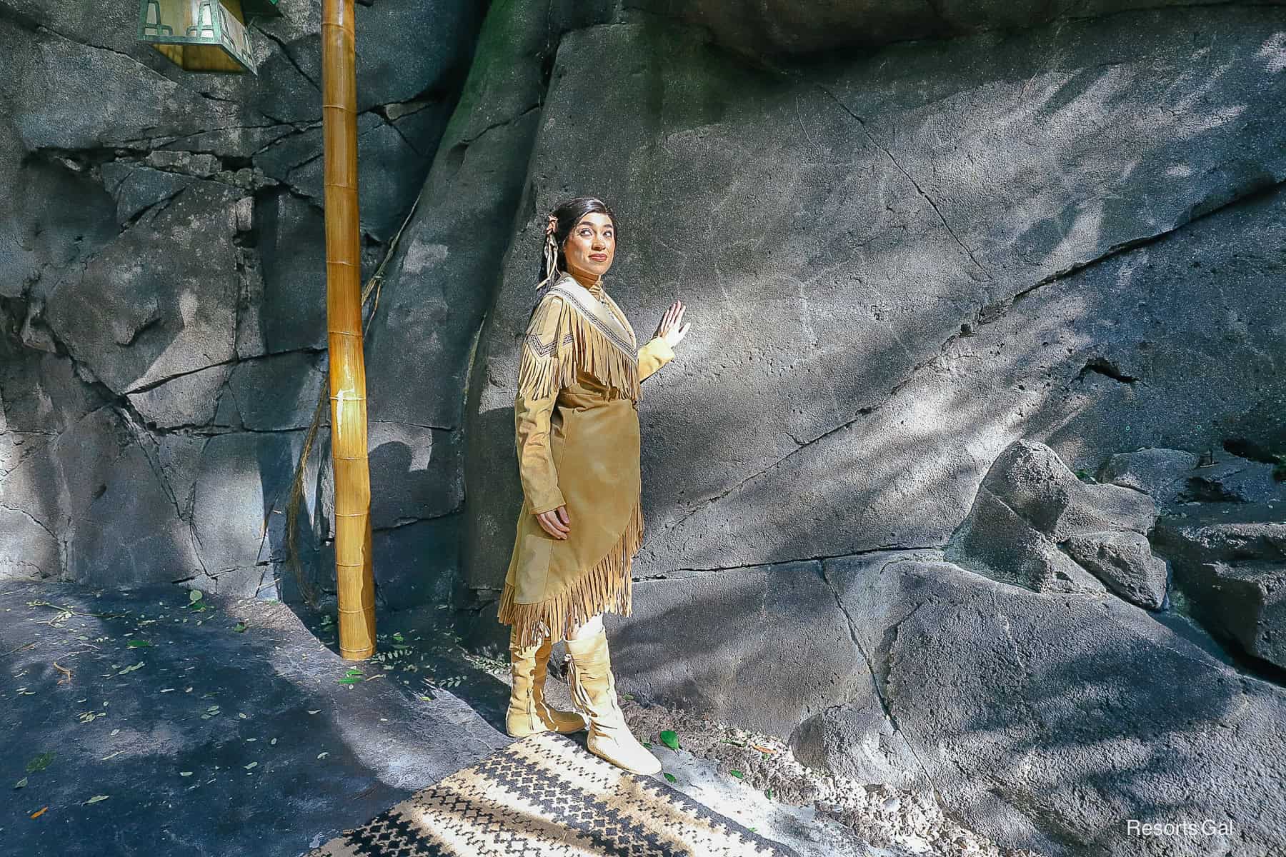 Pocahontas in the Oasis next to a rock wall