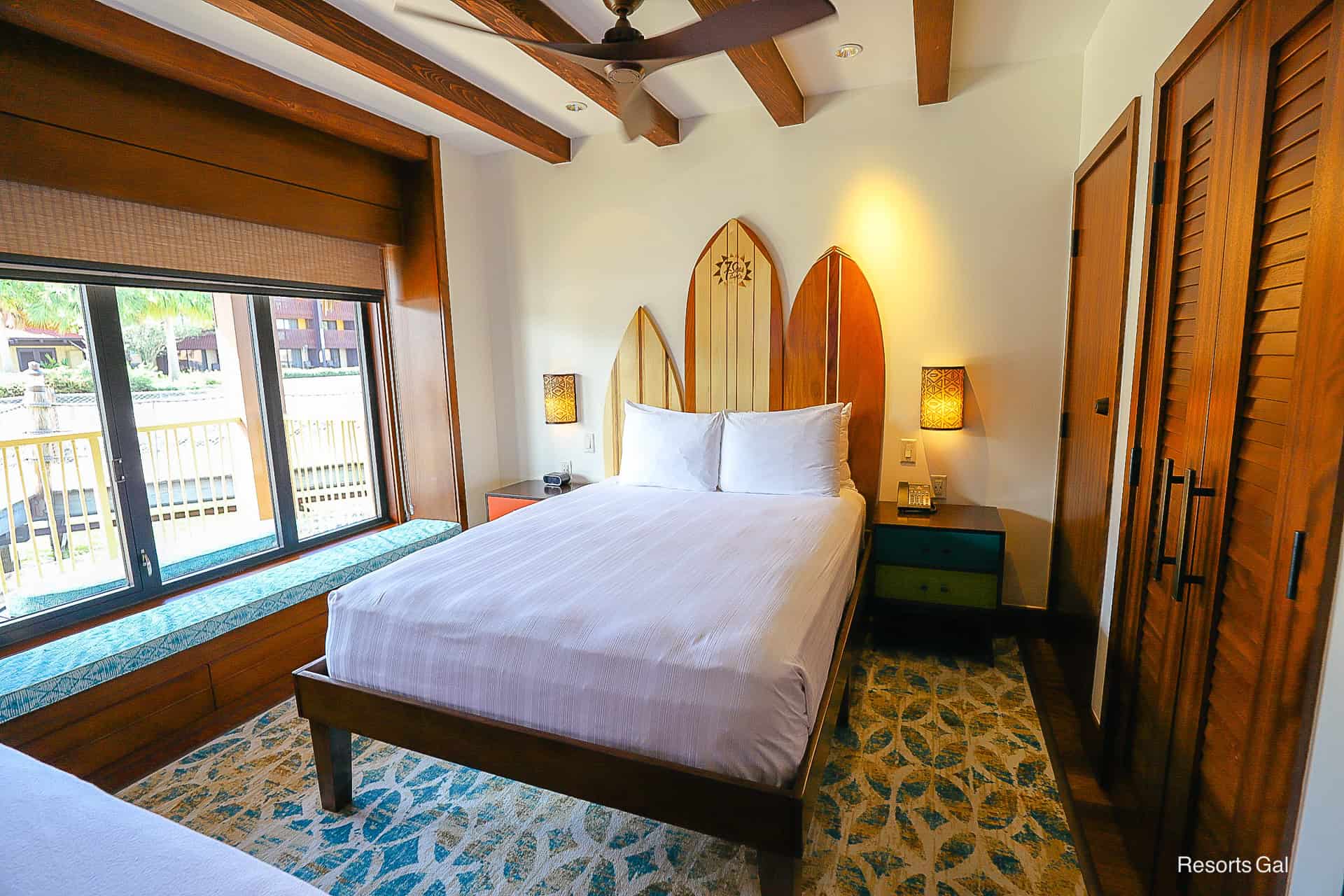 a bedroom with a queen size bed on the front of the bungalows