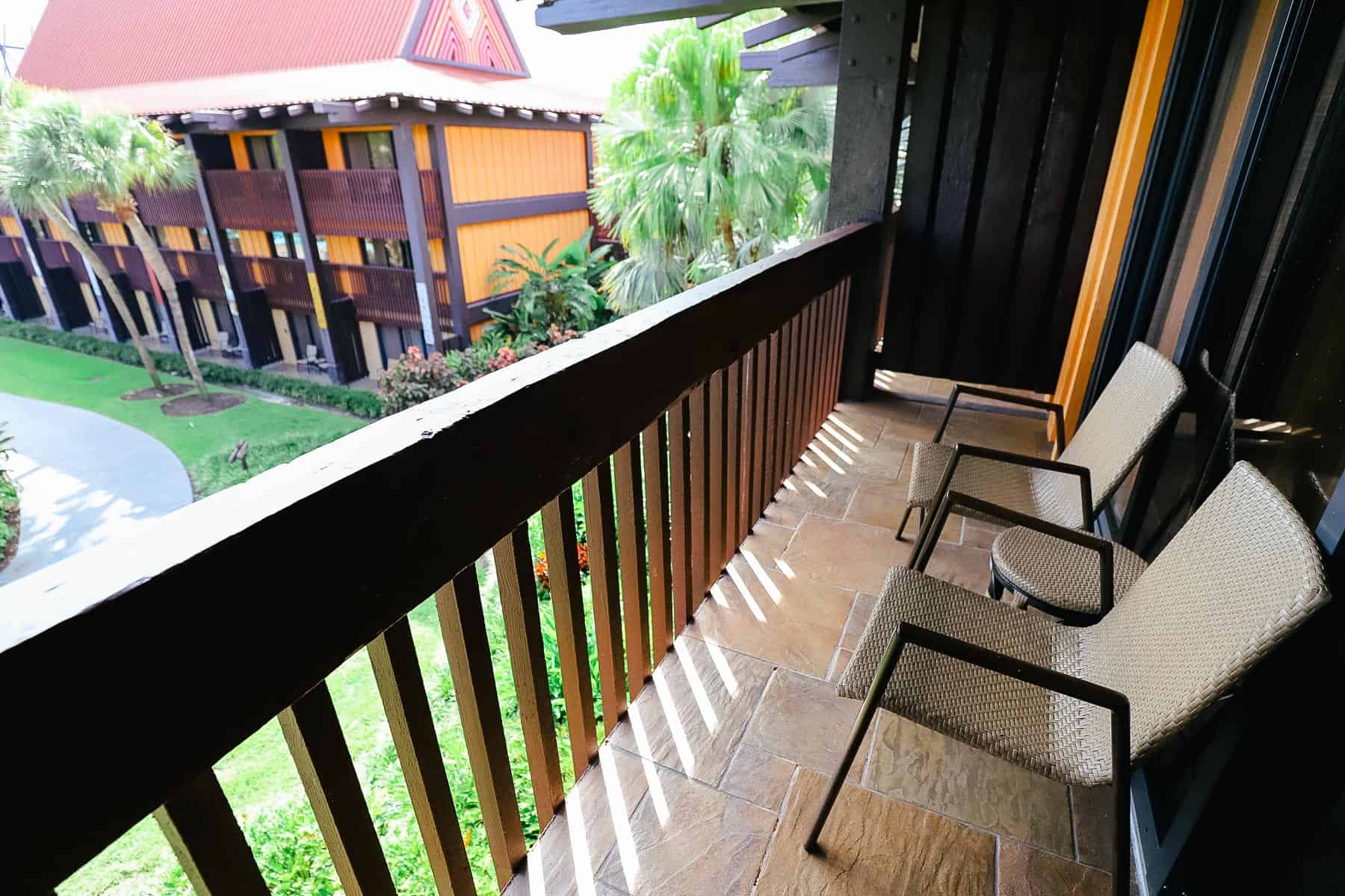 balcony with two chairs and small table 