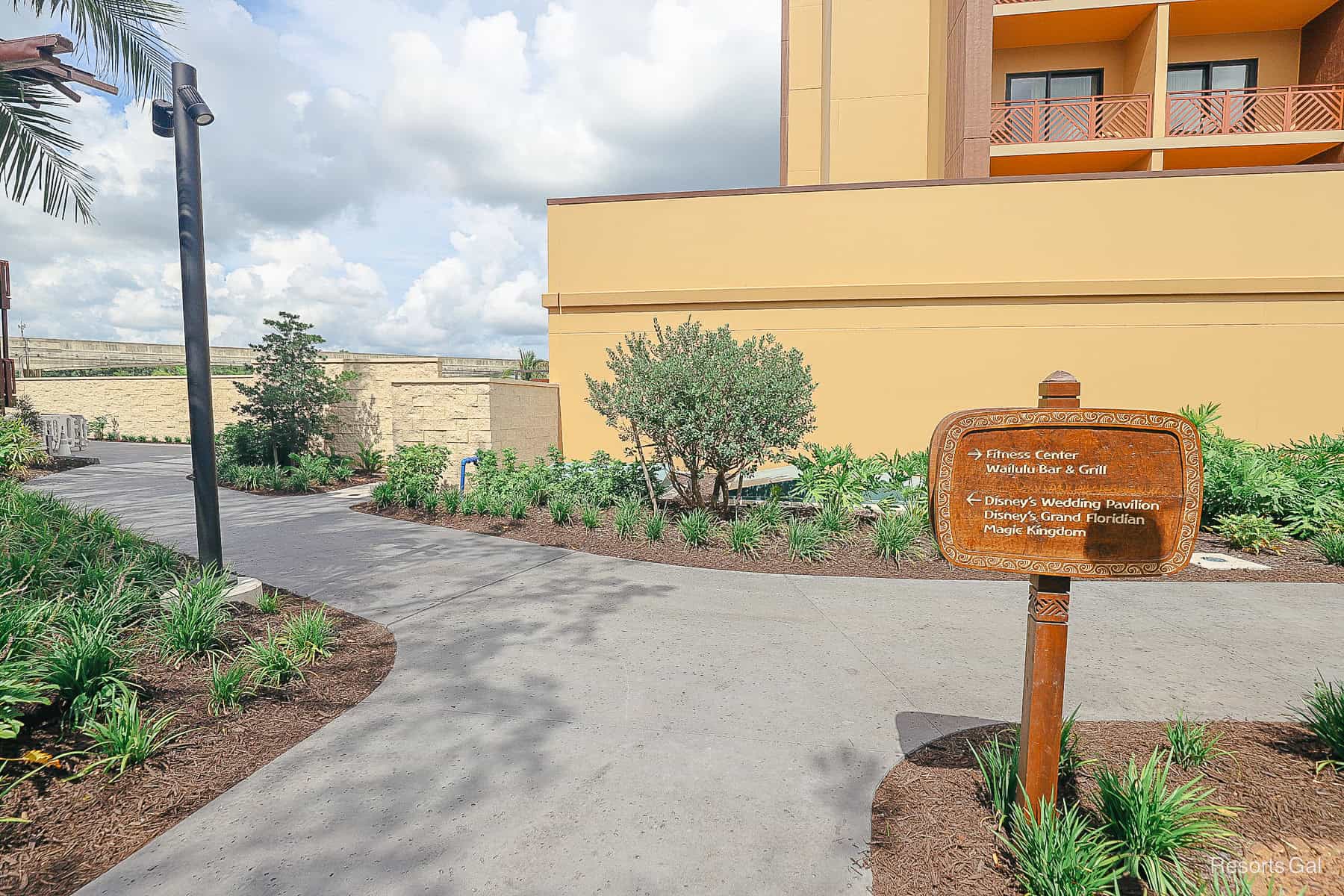 a sig with directionals in tropical landscaping
