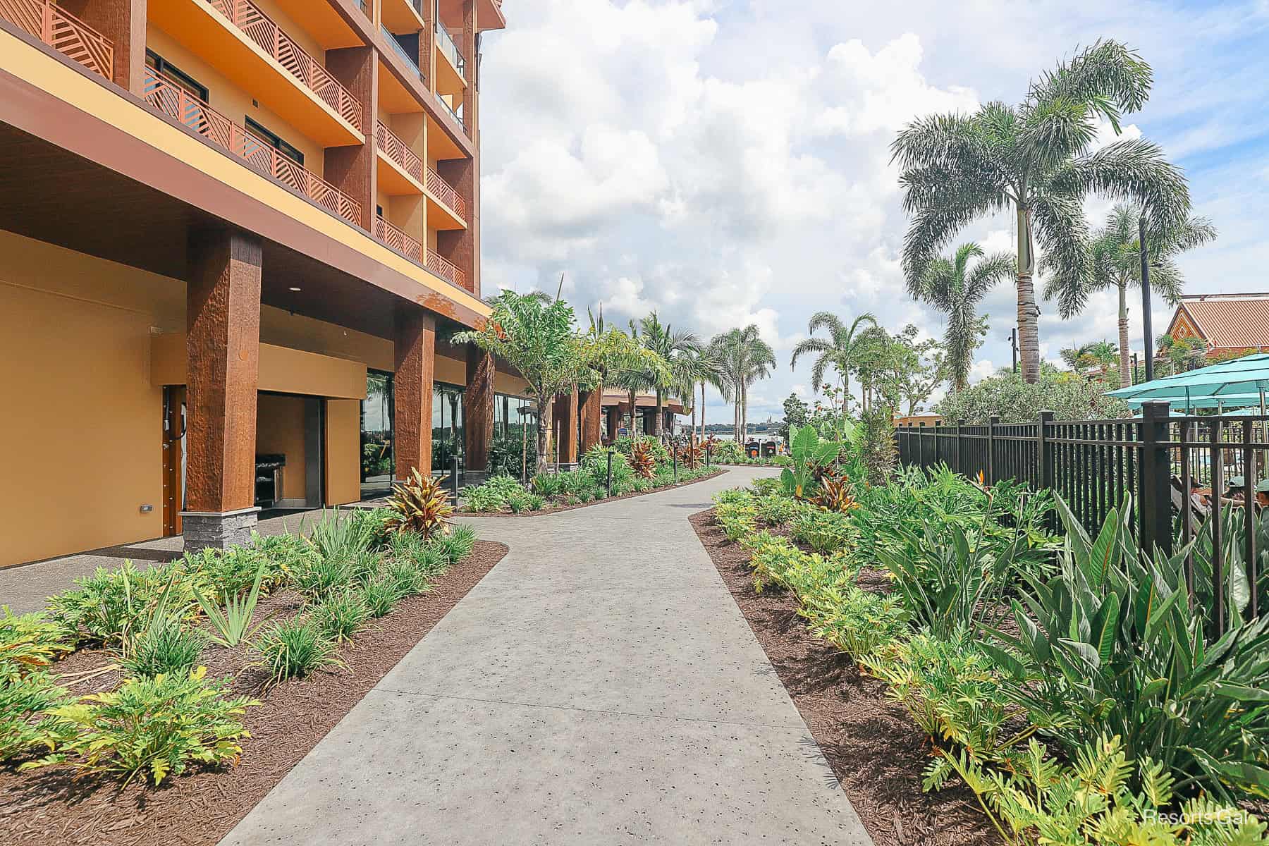 a walking path with Seven Seas Lagoon in the distance