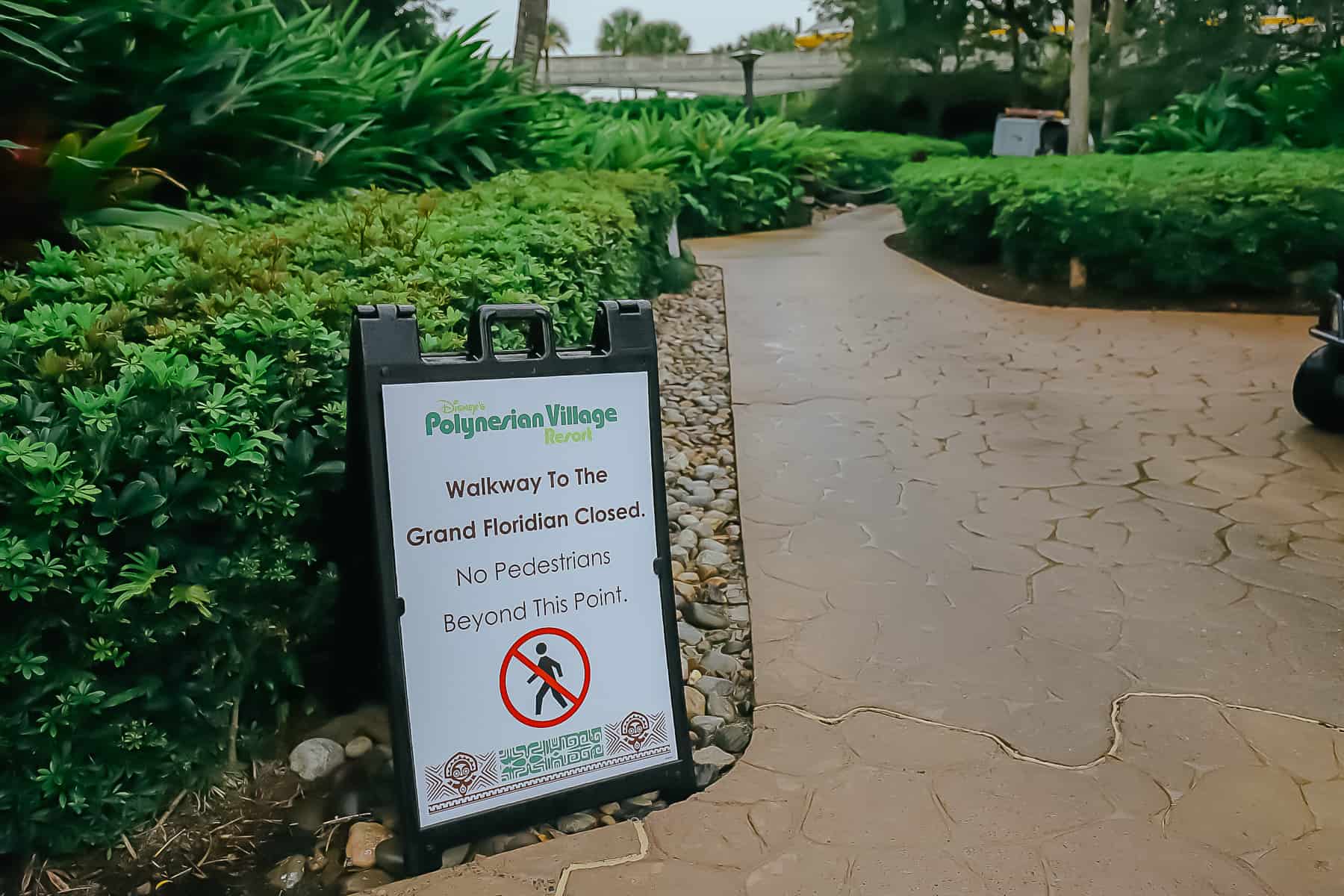 sign that says the walkway to the Grand Floridian is closed 