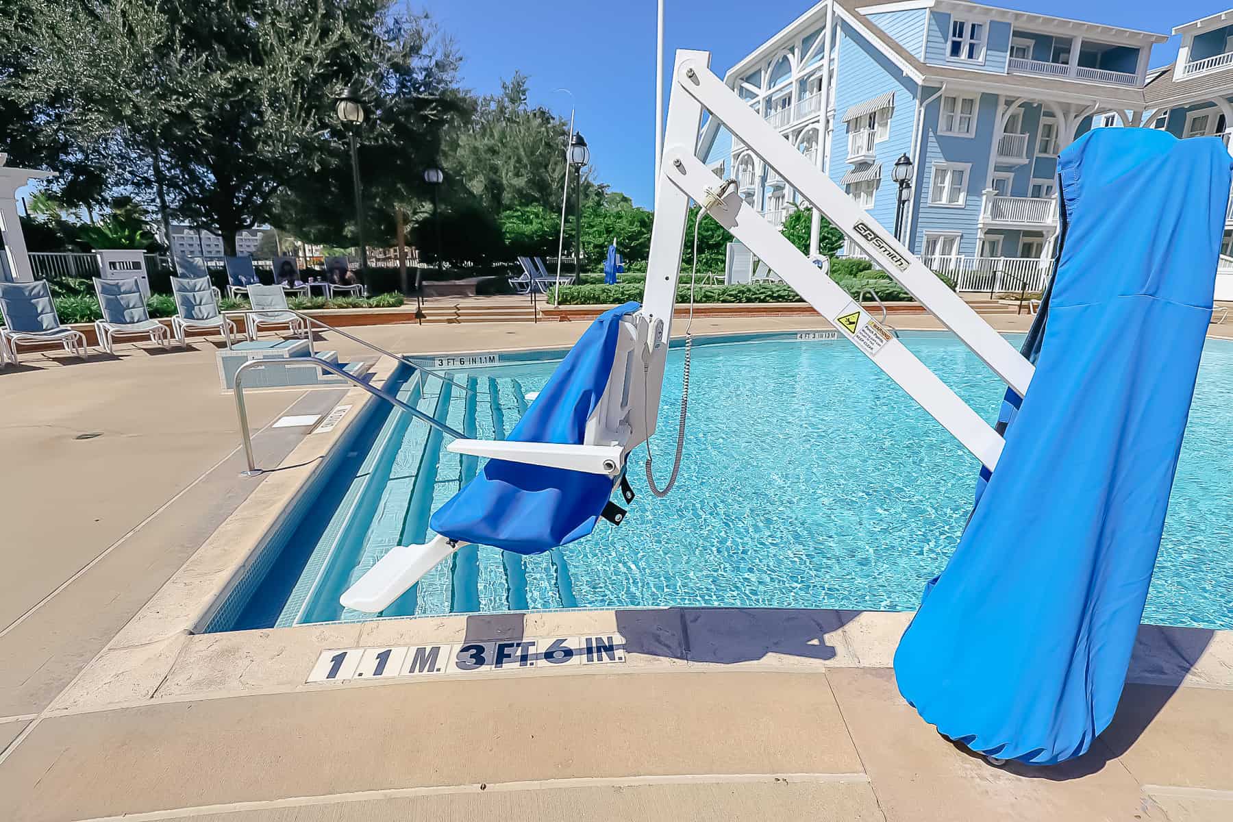 a mobility lift at a pool at Disney's Beach Club 