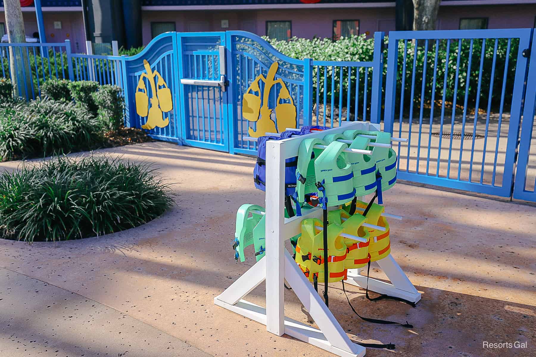 a stand with complimentary lifejackets in various sizes at All-Star Movies Pool