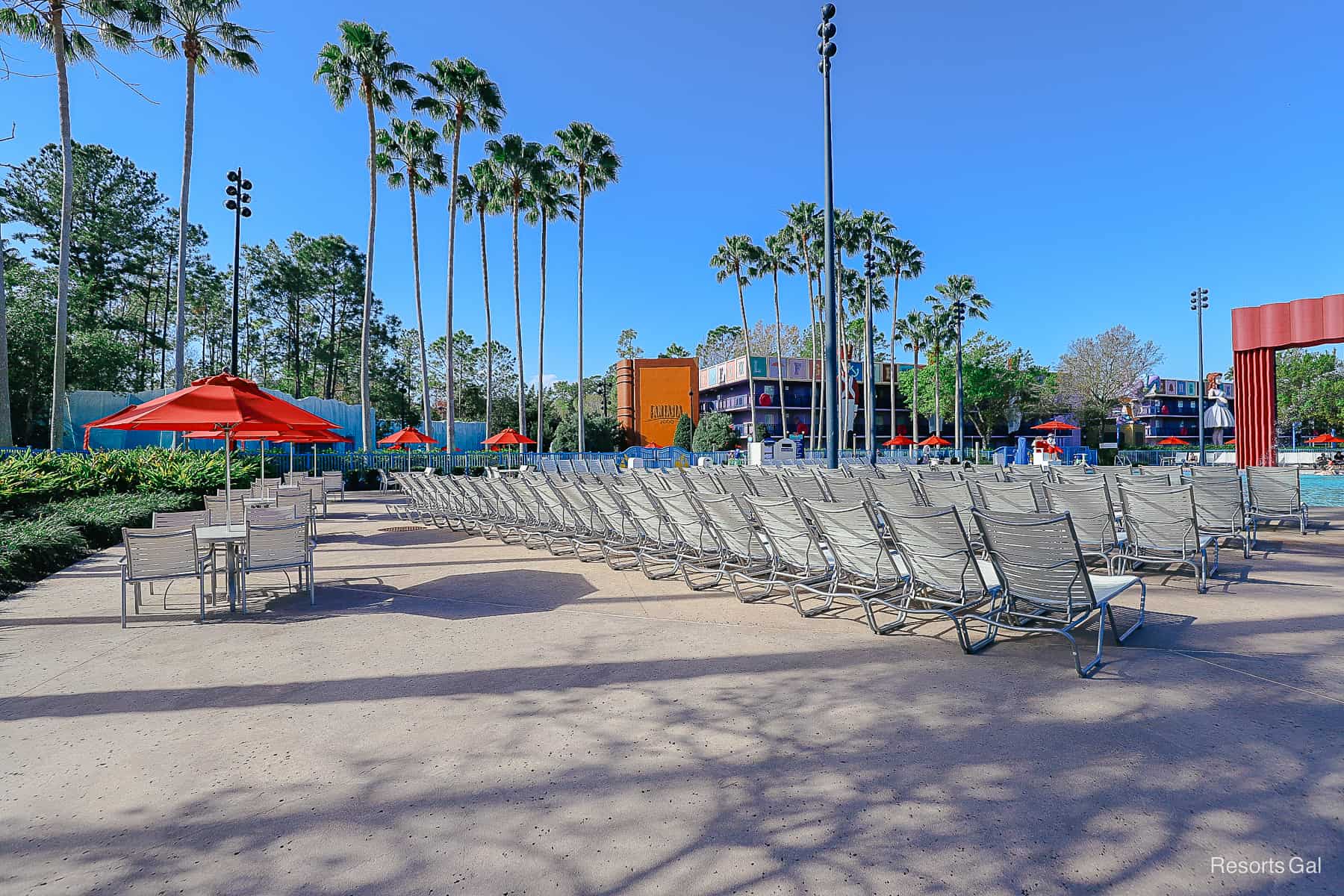 rows of lounge chairs facing the pool at Disney's All-Star Movies 