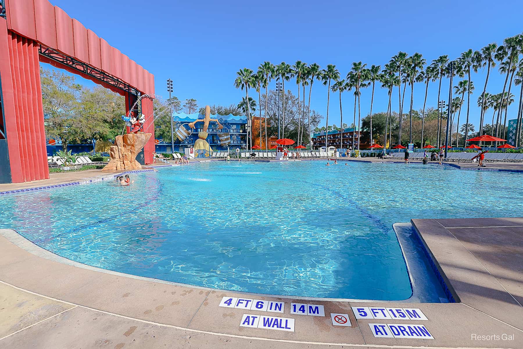 Shows a side view of the pool with Fantasia mops and buckets in the background. 