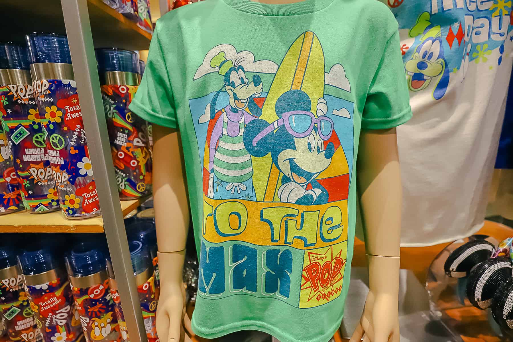 A Pop Century logo shirt with Goofy and Mickey Mouse that says, "To the Max." 