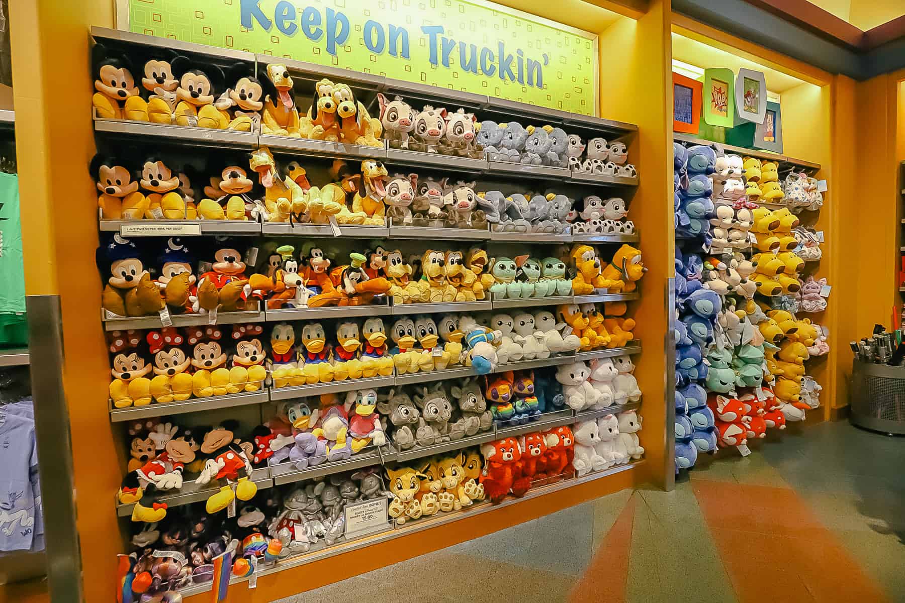 a wall with Disney plush 
