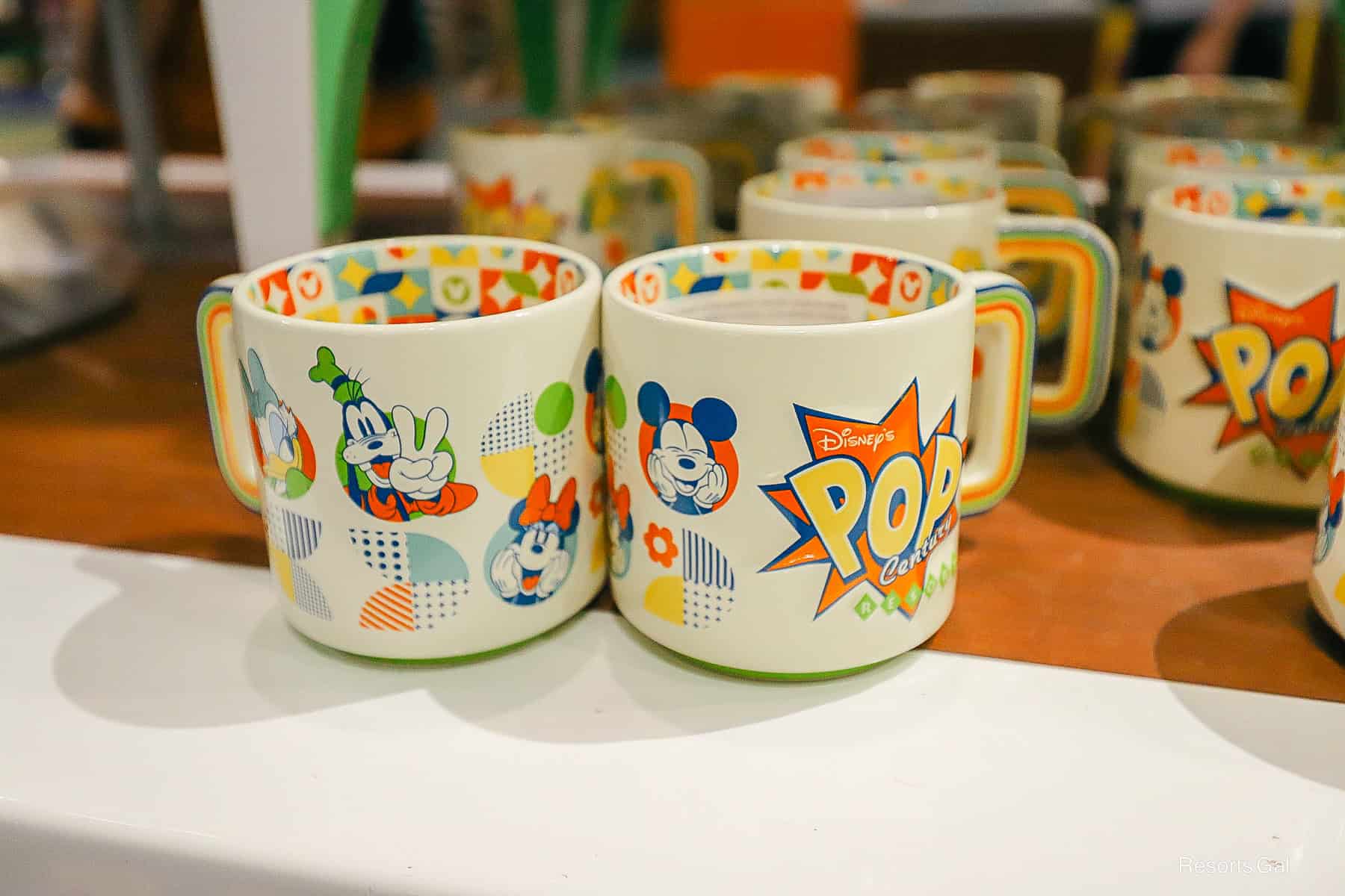 two sides of the Disney's Pop Century Resort logo mug