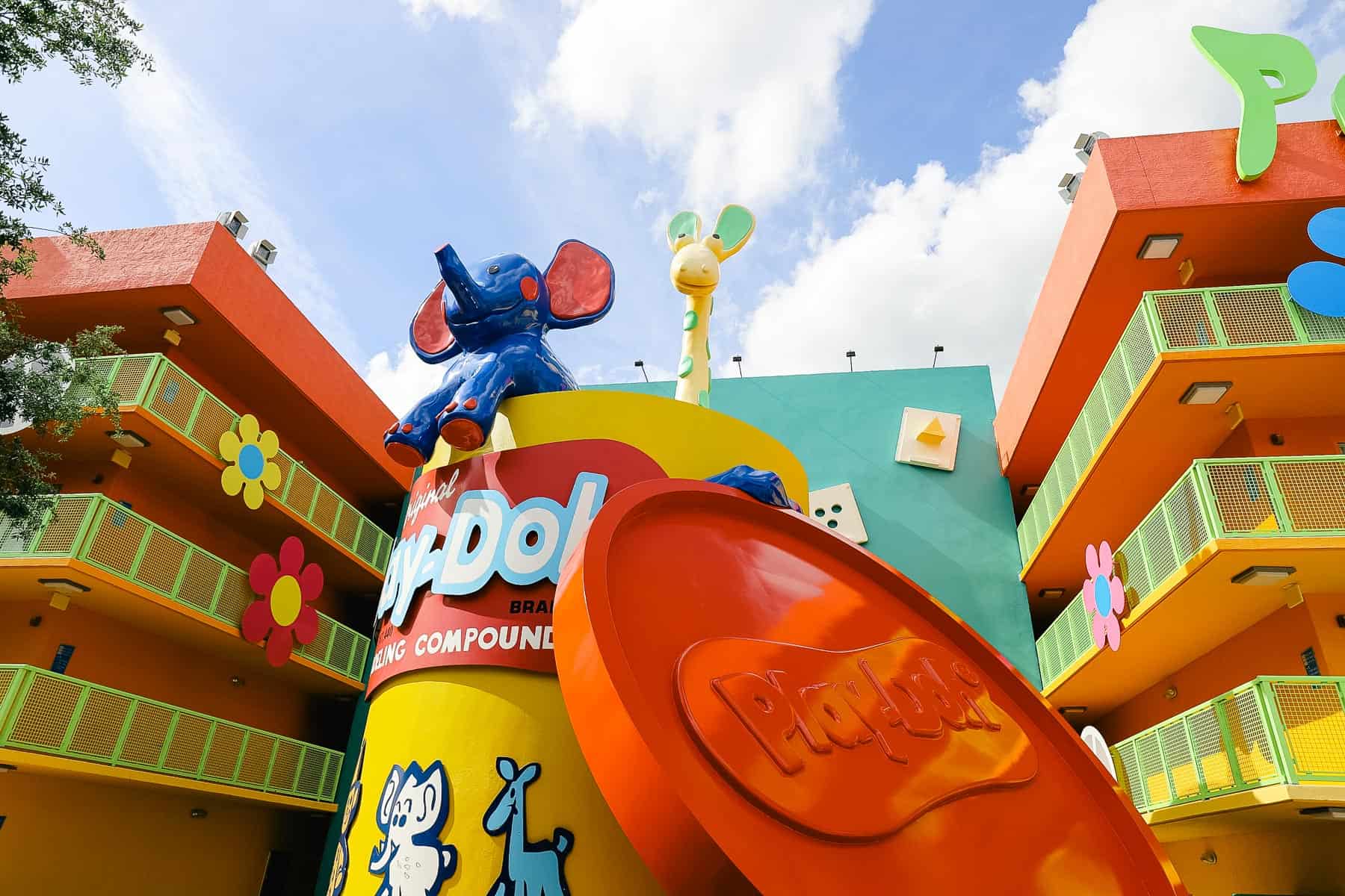 giant cup of Play-Doh with an elephant and giraffe in the 60s courtyard at Pop Century 