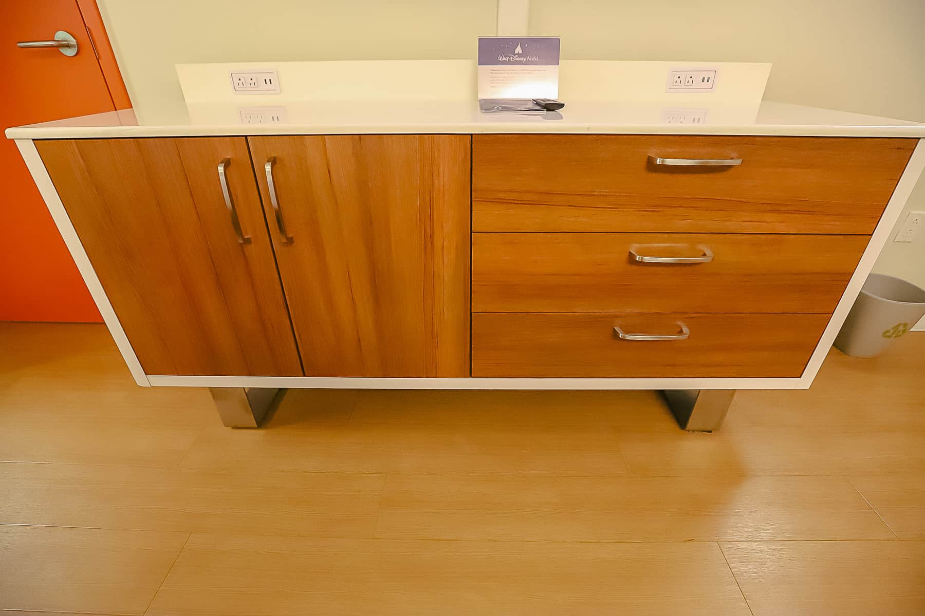 a dresser with outlets and storage drawers 