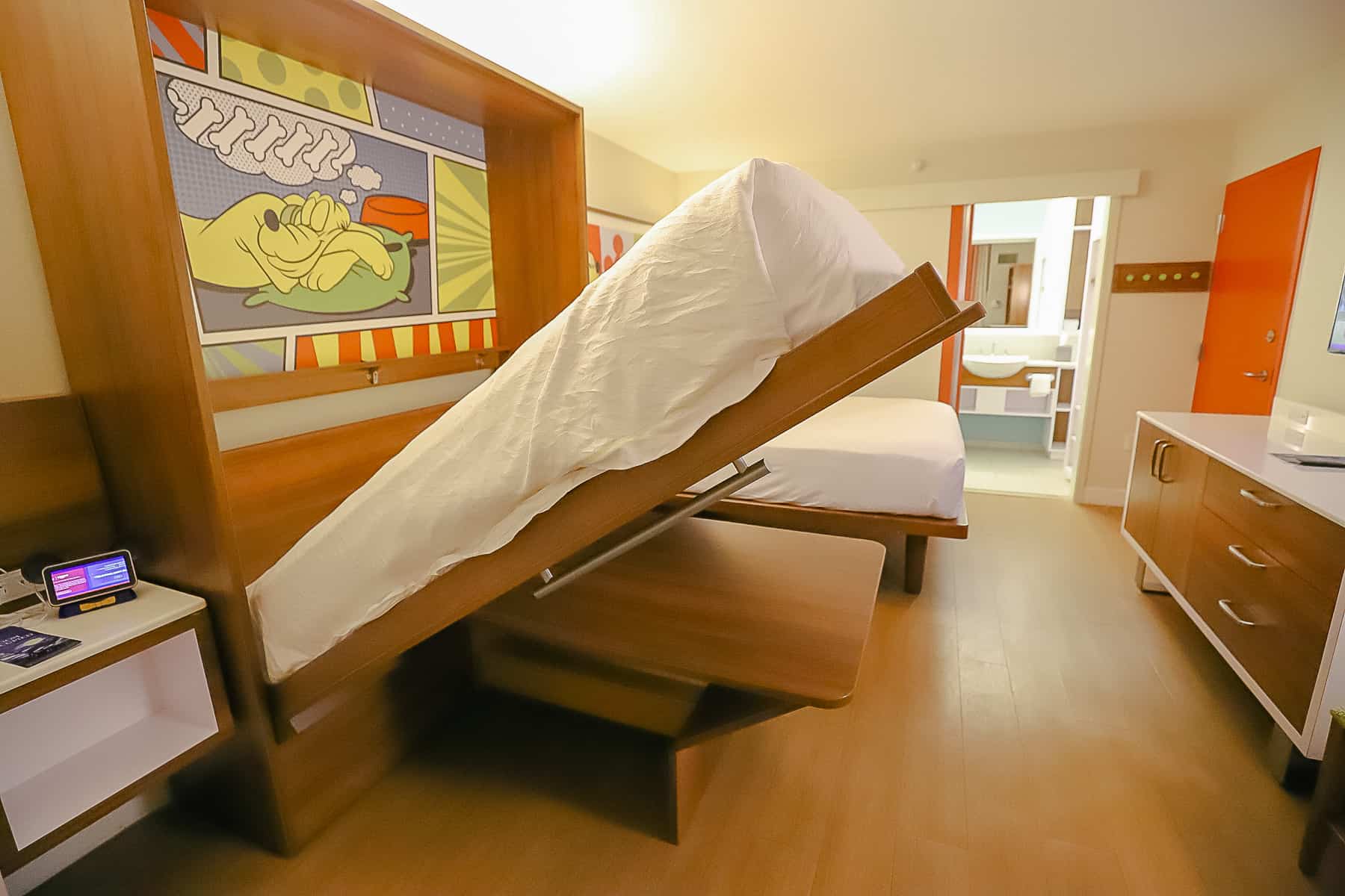 shows how one of the bed folds down from the wall 