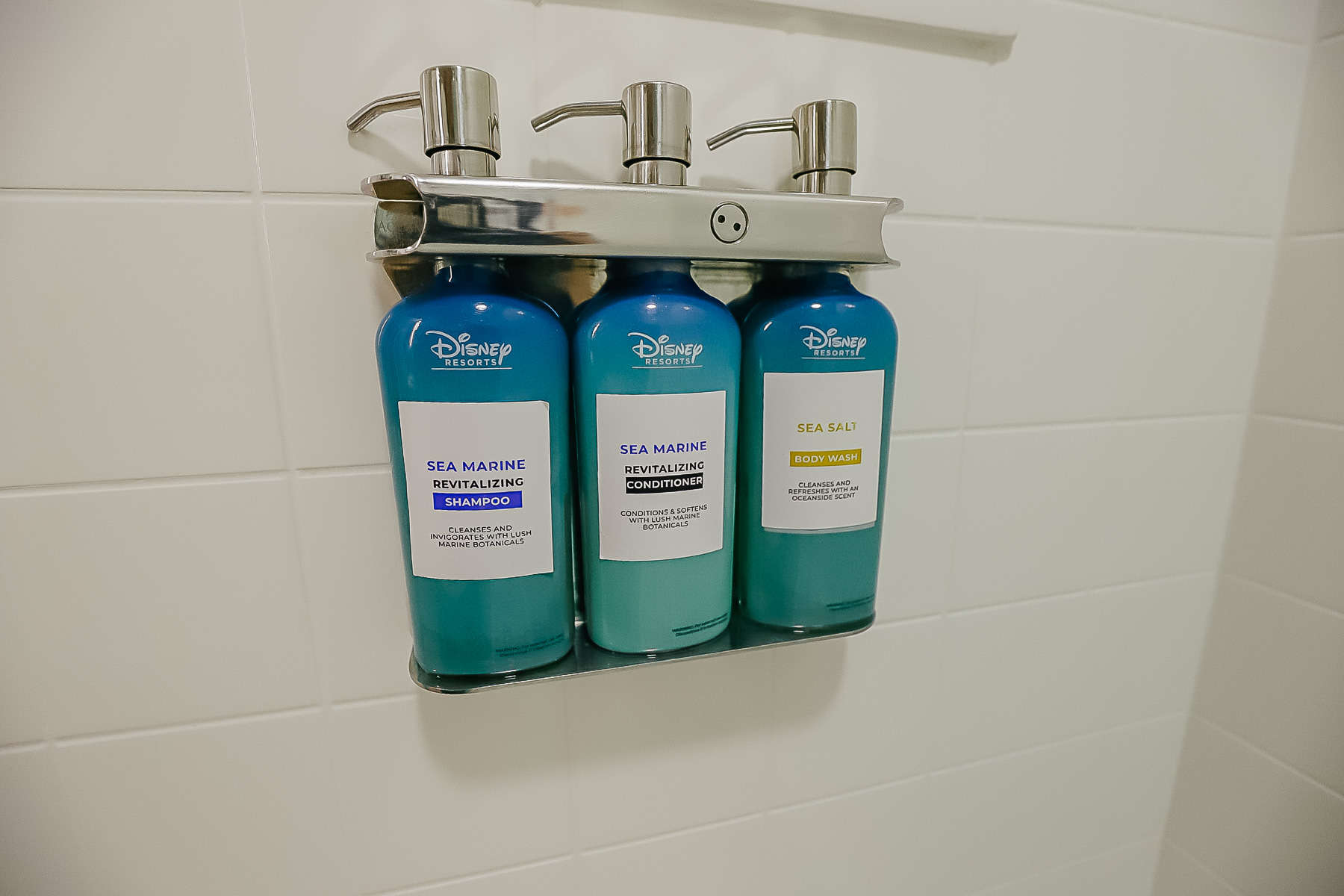 a built-in dispenser with soap, shampoo, and conditioner