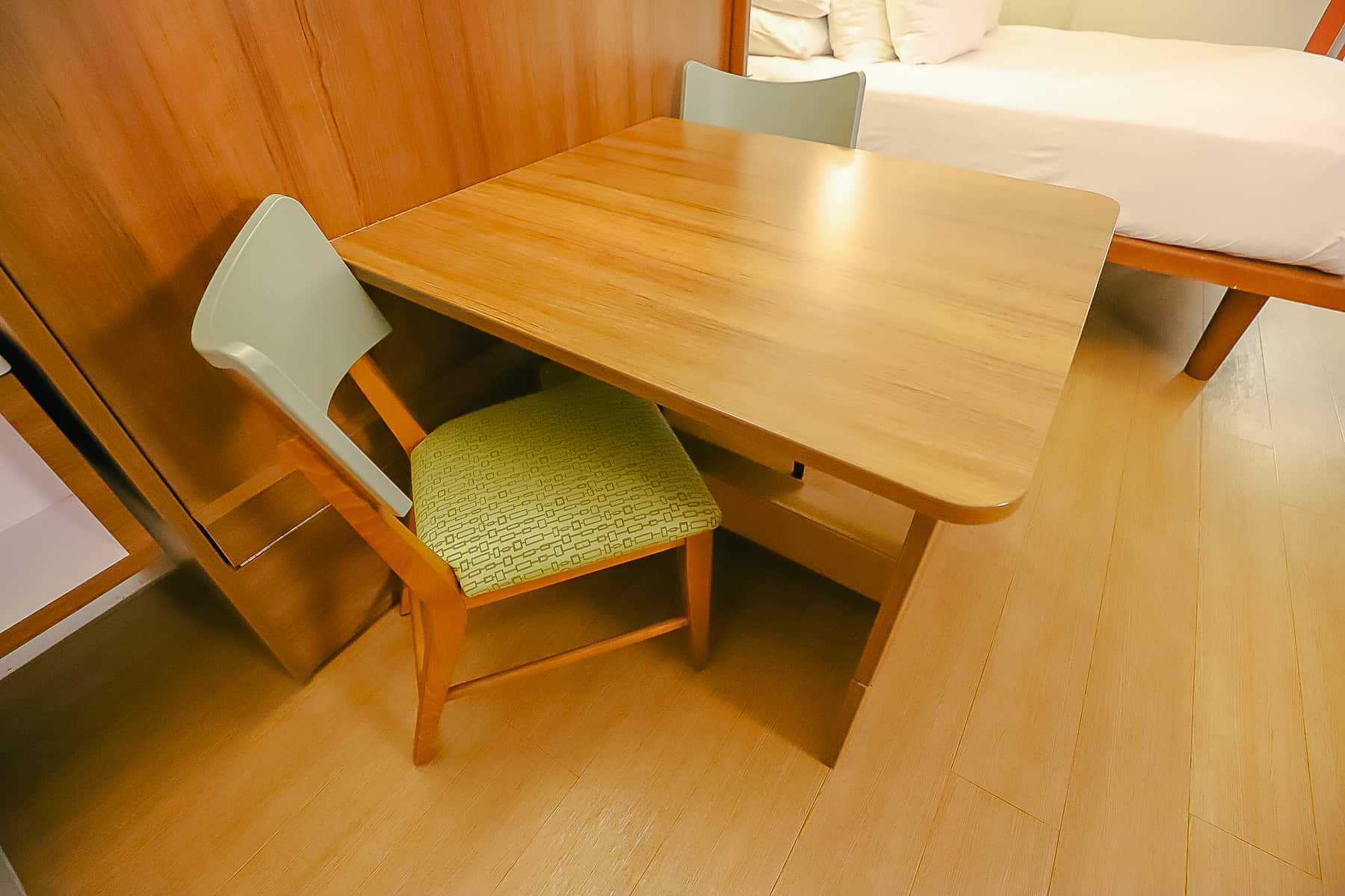 table with two chairs in room at Pop Century 
