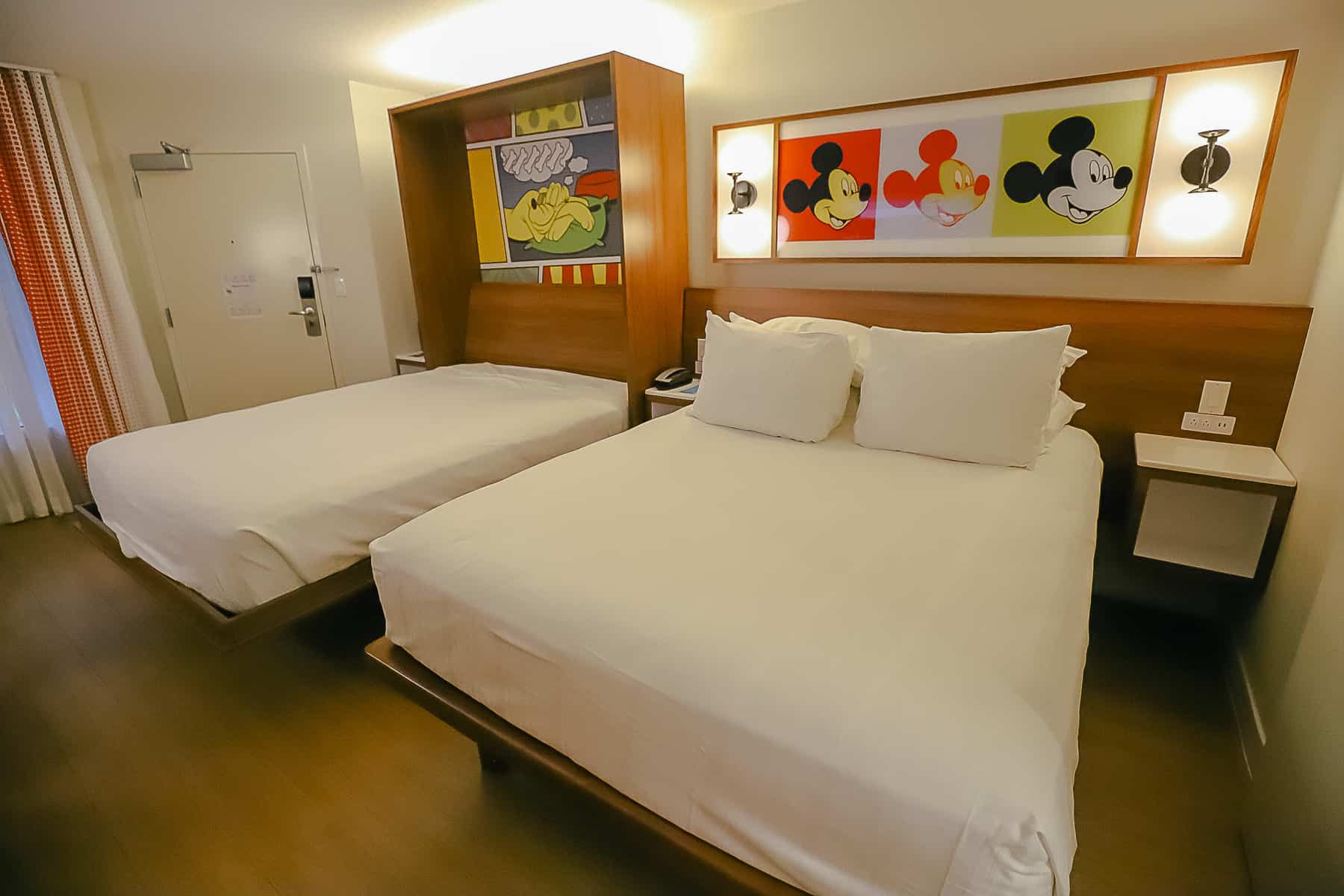 the two beds in a room at Disney's Pop Century 