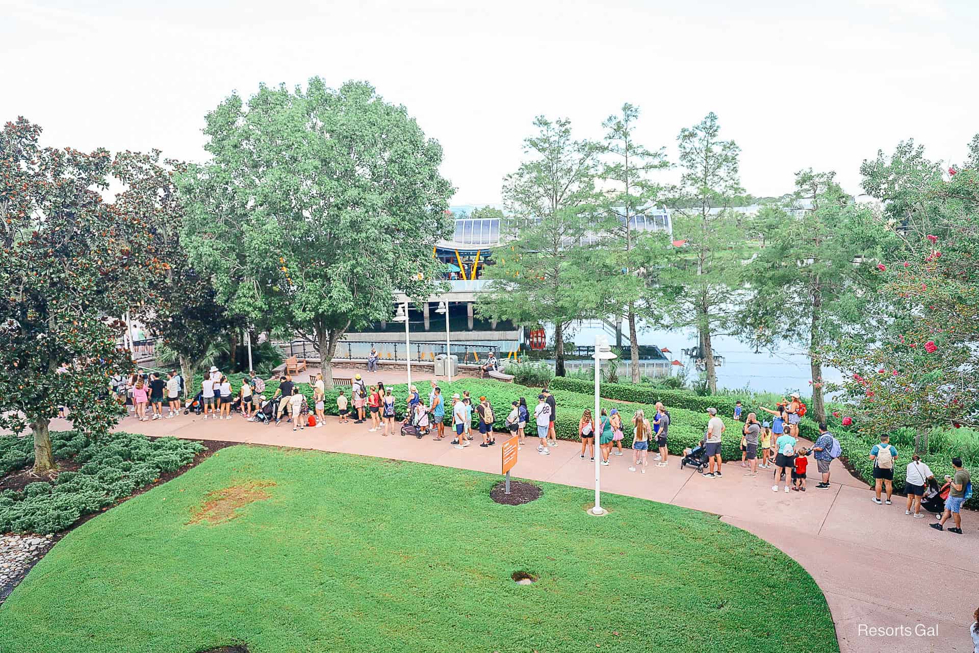 a portion of a long line of guests waiting for the Skyliner 
