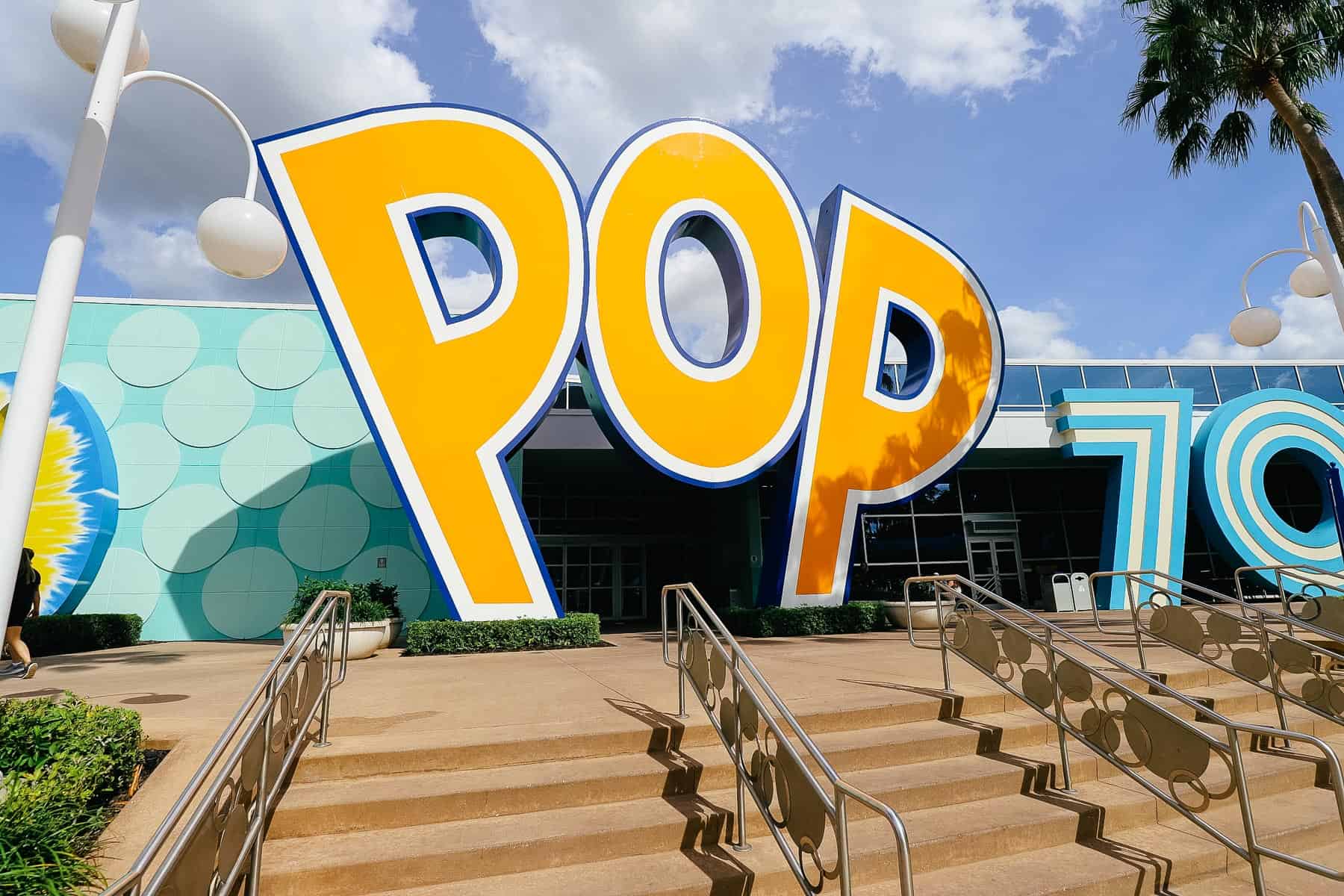 a large yellow sign that spells out pop 