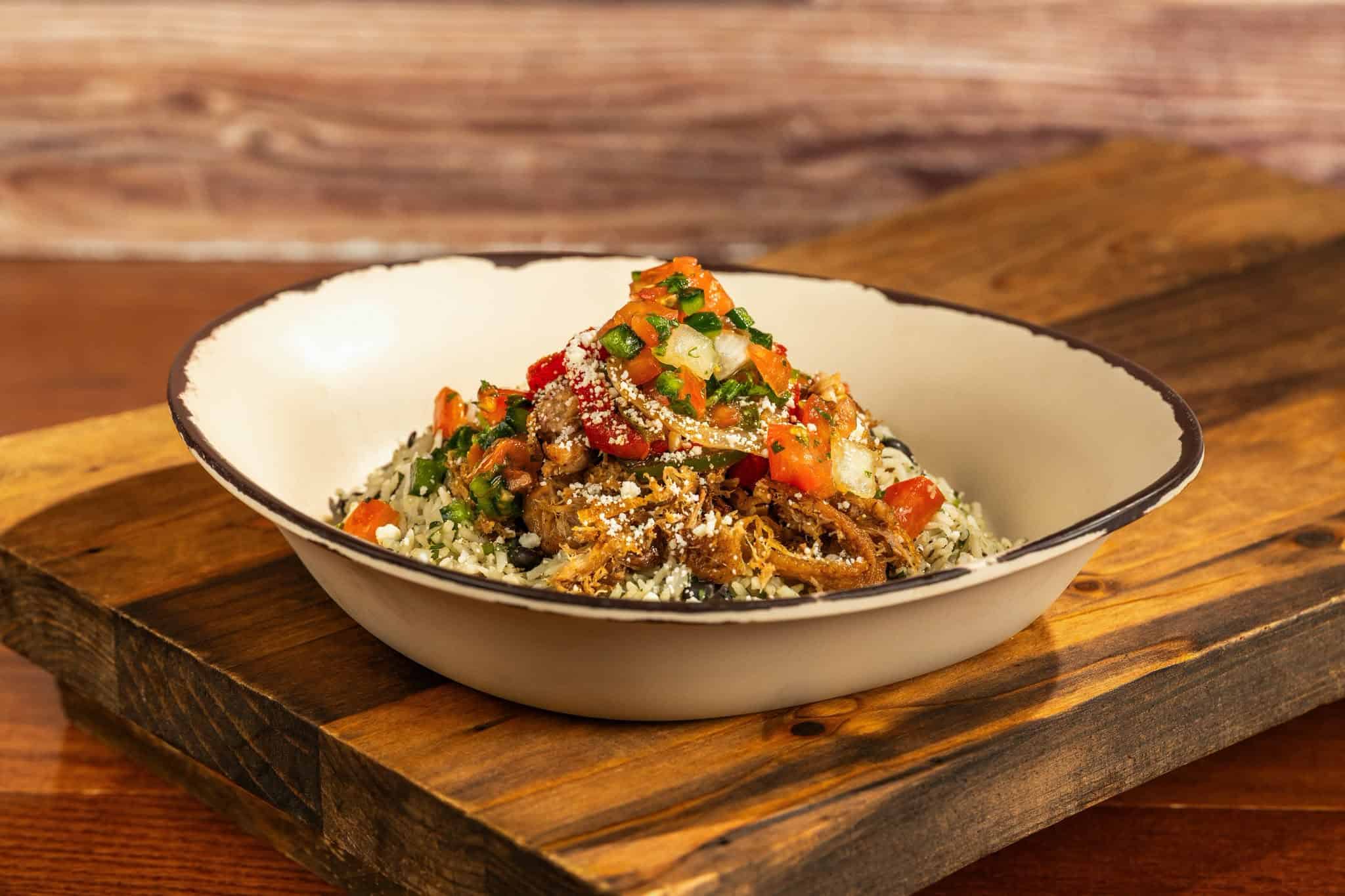 a bowl of pork carnitas from Sunshine Seasons at Epcot 