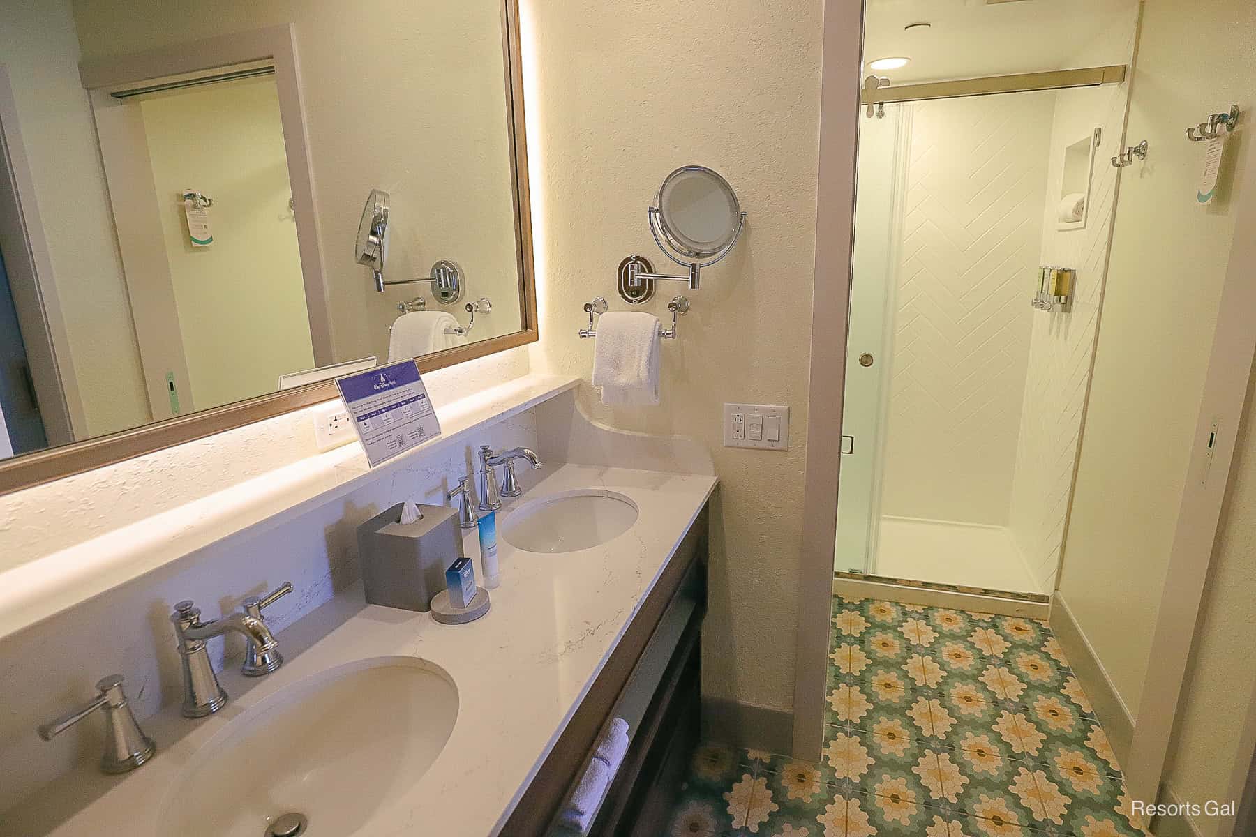 the bathroom's vanity area is separate from the water closet