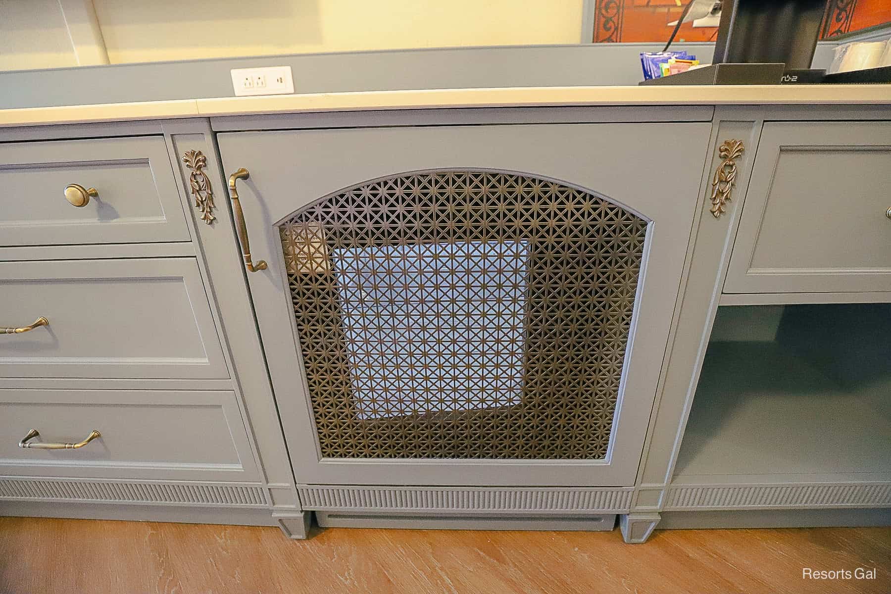 a screen door that hides the room's beverage cooler