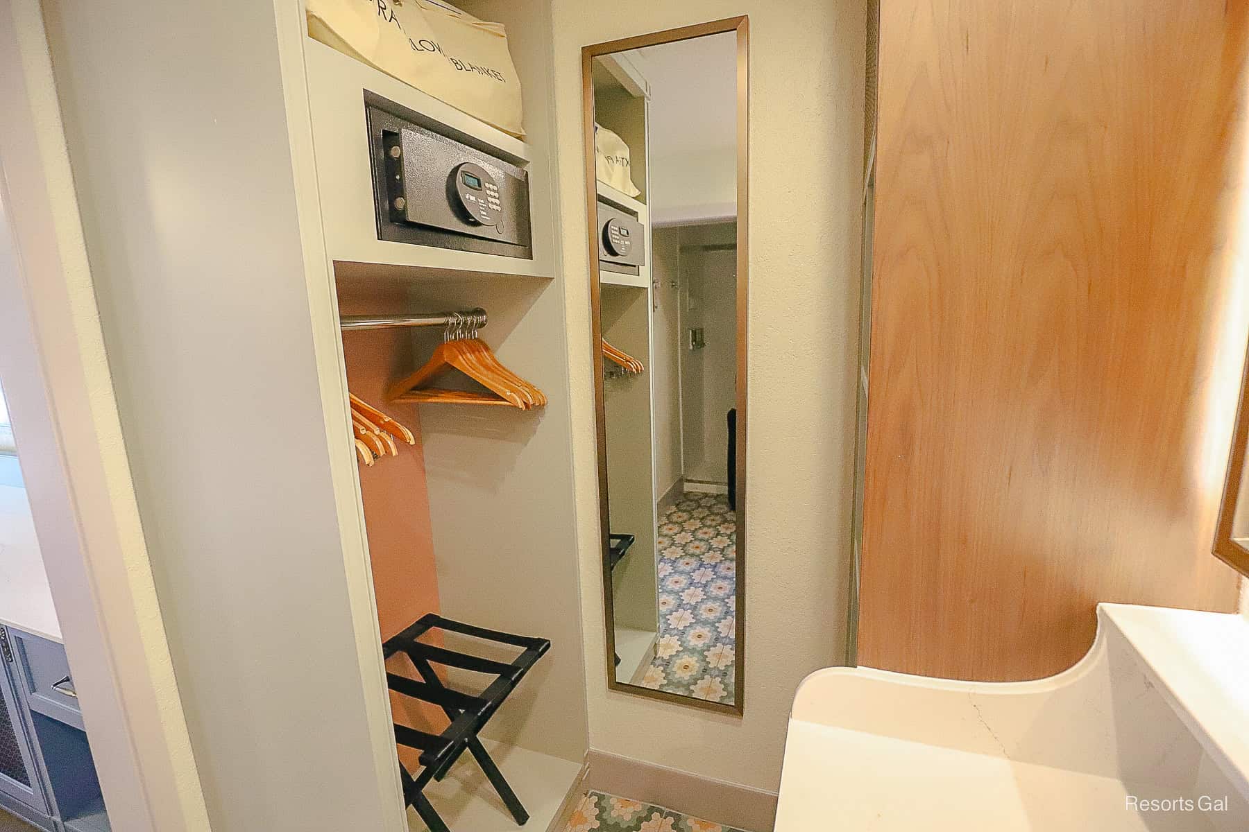 shows the hanging area that's open with a luggage rack