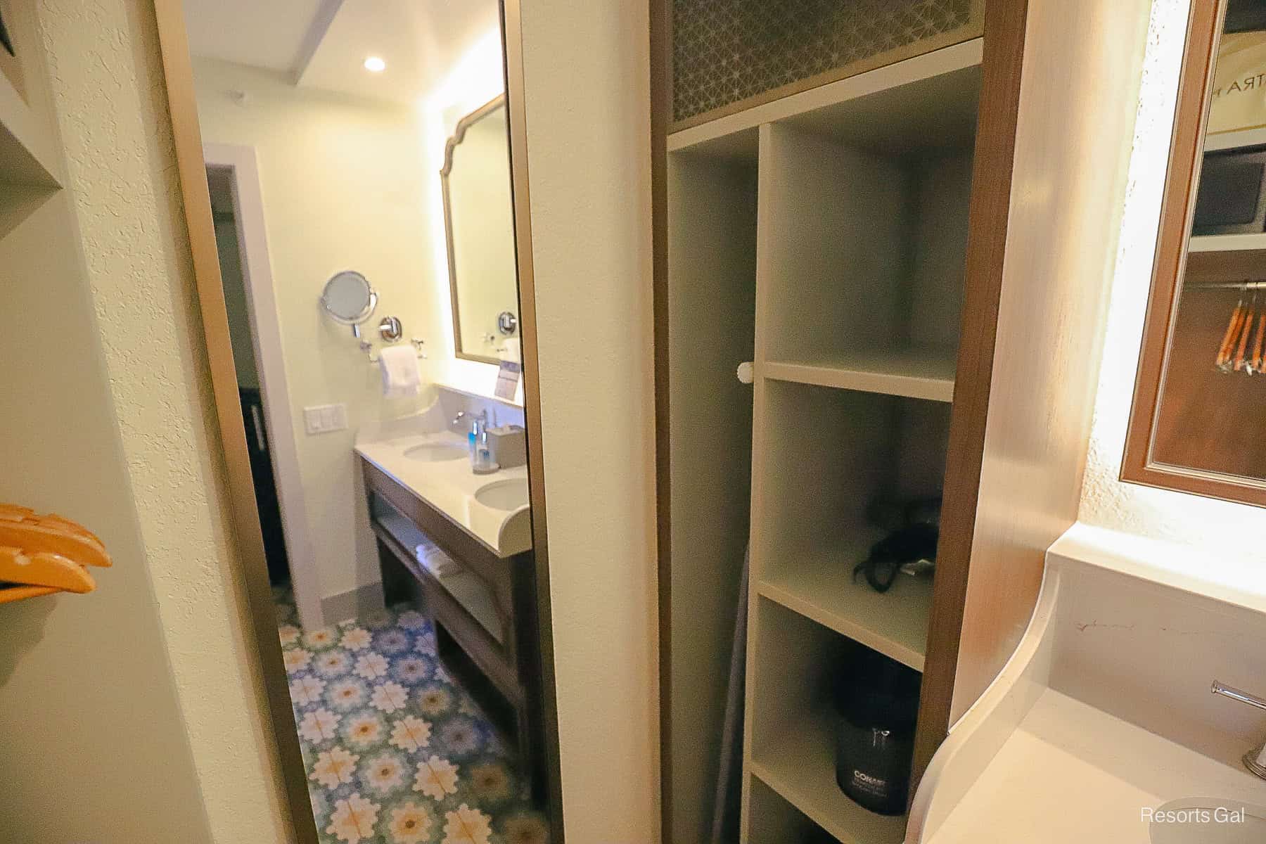 shows the mini closet area to the far side of the vanity and a full length mirror
