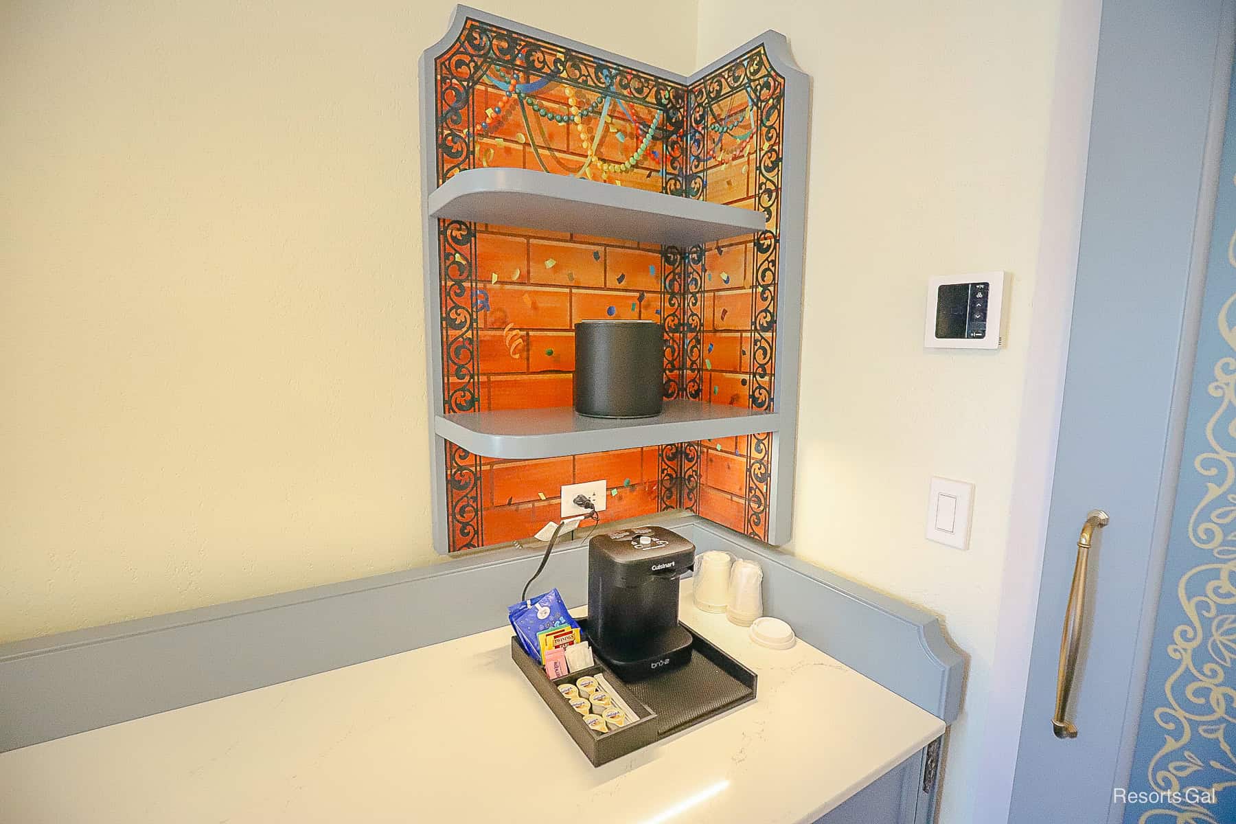 the corner of the room has a Mardi Gras decorative corner finish with shelves