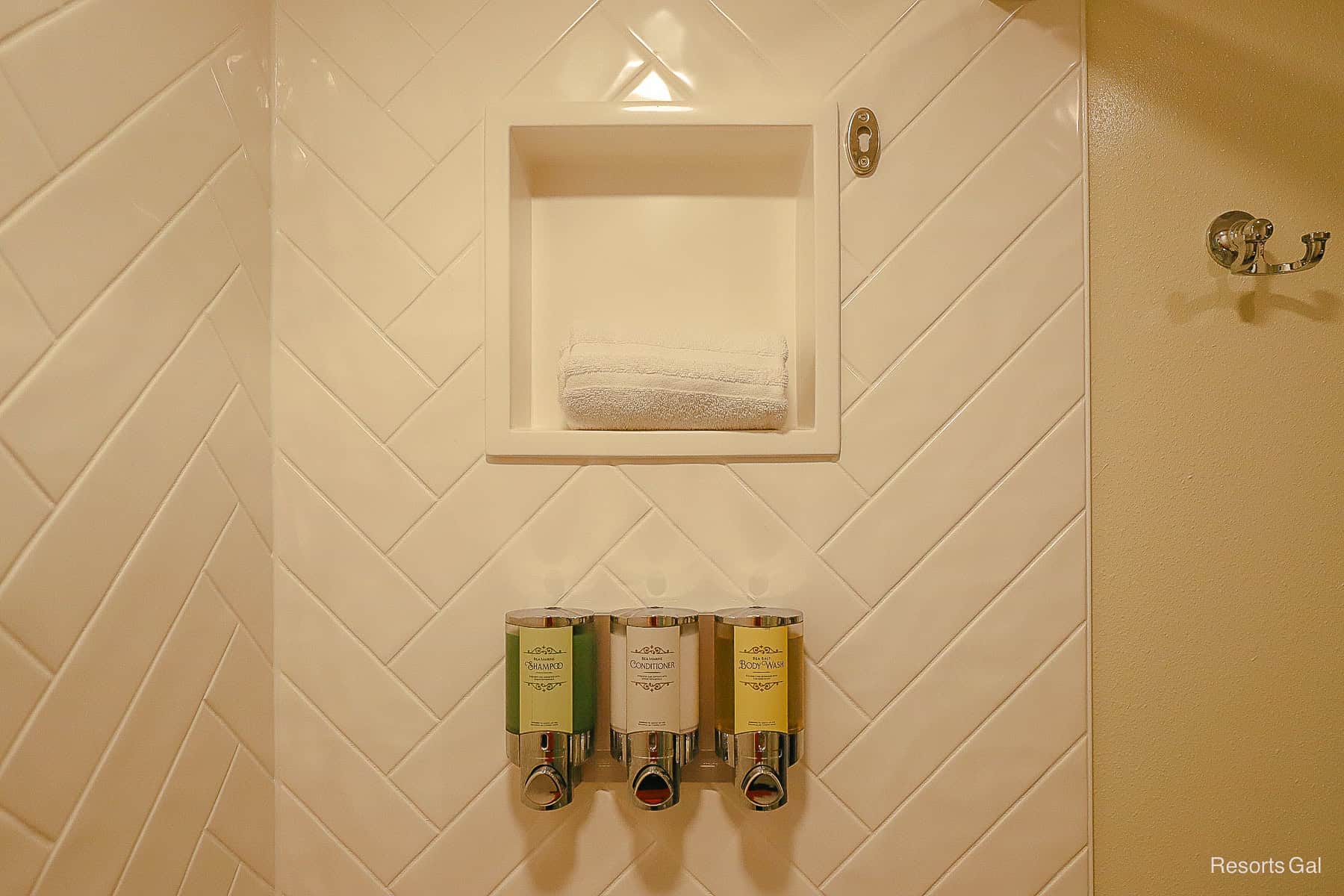 the shower has a built in nook and white rick-rack surround