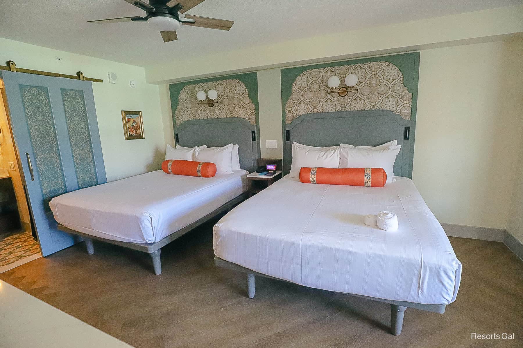 the two beds have room to store luggage underneath them