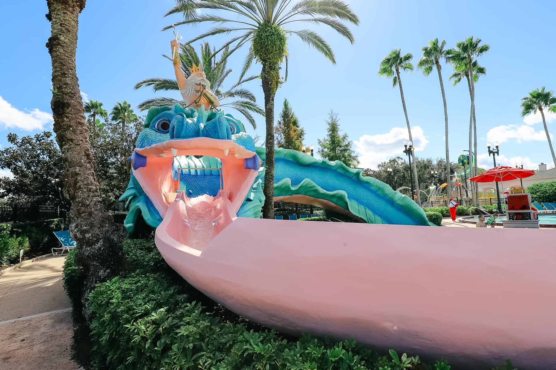 a long pink slide that looks like the serpent's tongue 