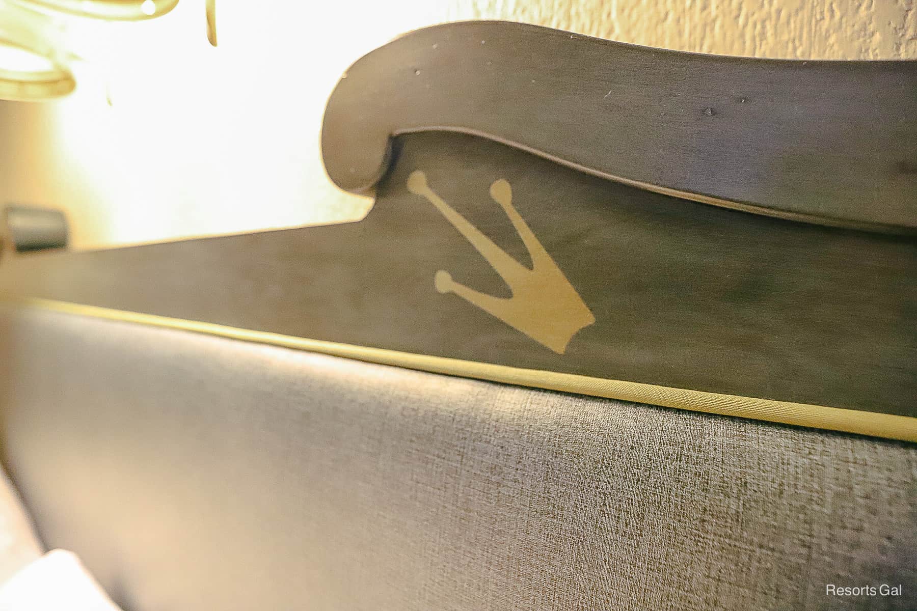 A crown accent painted on the room's headboard. 